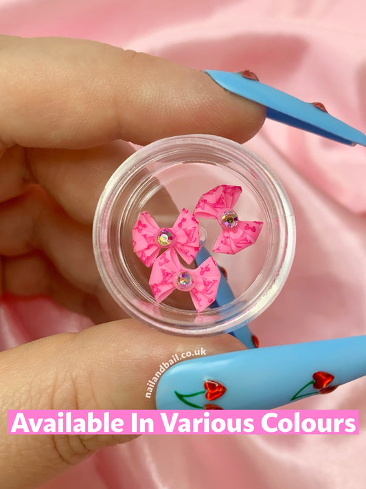 Introducing our absolutely adorable handmade Bright Louis Vuitton Bow Nail Charms, designed to add a touch of cuteness and sparkle to your nails! These charming little bows are the perfect accessory for any nail art enthusiast who loves all things girly.