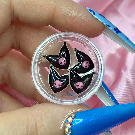 Elevate your nail game with our 6pcs handmade Kuromi Skull Heart Nail Charms! 🖤💀These charms feature black hearts with Kuromi's ears on top and her iconic pink skull in the center, adding an edgy yet cute twist to your manicure effortlessly. Order now and let Kuromi bring a touch of unique charm to your nails! 