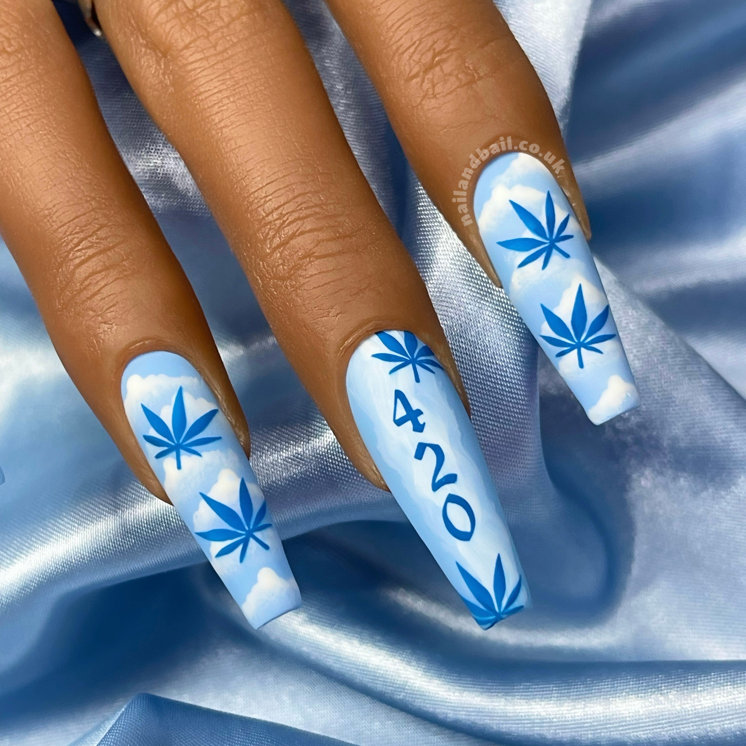 Ascend to new style heights with our "Sky High" press-on nails! Baby blue bases complement hand-painted white smoke on your thumbs and pinkies, while your pointer and ring fingers feature whimsical white clouds and dark blue weed leaves. And on your middle finger, make a bold statement with hand-painted white smoke, 420 numbers, and weed leaves. Finished with a matte top coat for a flawless finish, these nails are the ultimate in elevated style! 🍃💙