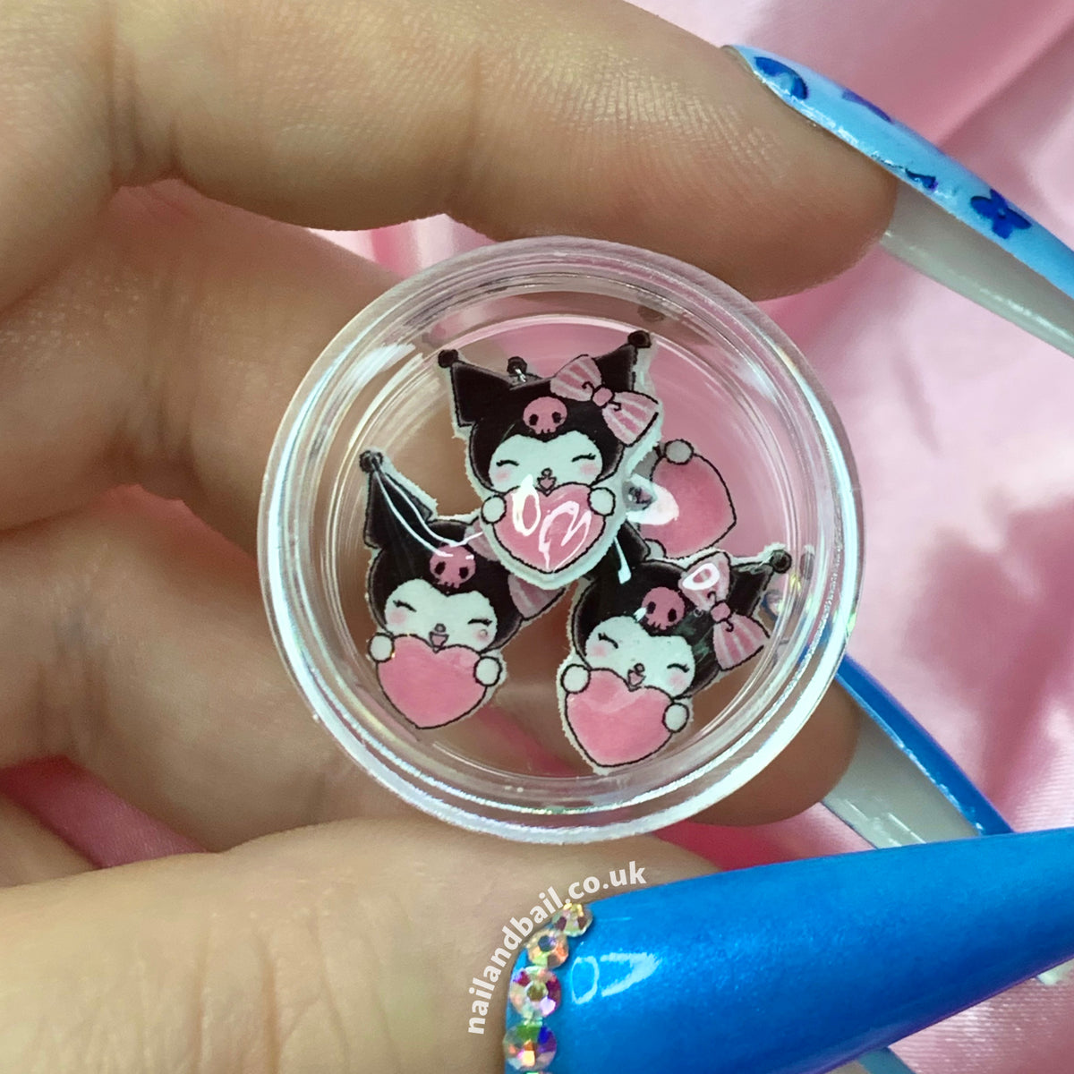 Elevate your manicure game with our 6pcs handmade Kuromi nail charms! 🖤Each charm features the lovable Kuromi, complete with a cute pink bow, a heart, and an infectious smile. These tiny works of art add a playful touch to your nails effortlessly. Order now and let Kuromi bring a dash of kawaii charm to your nails! 