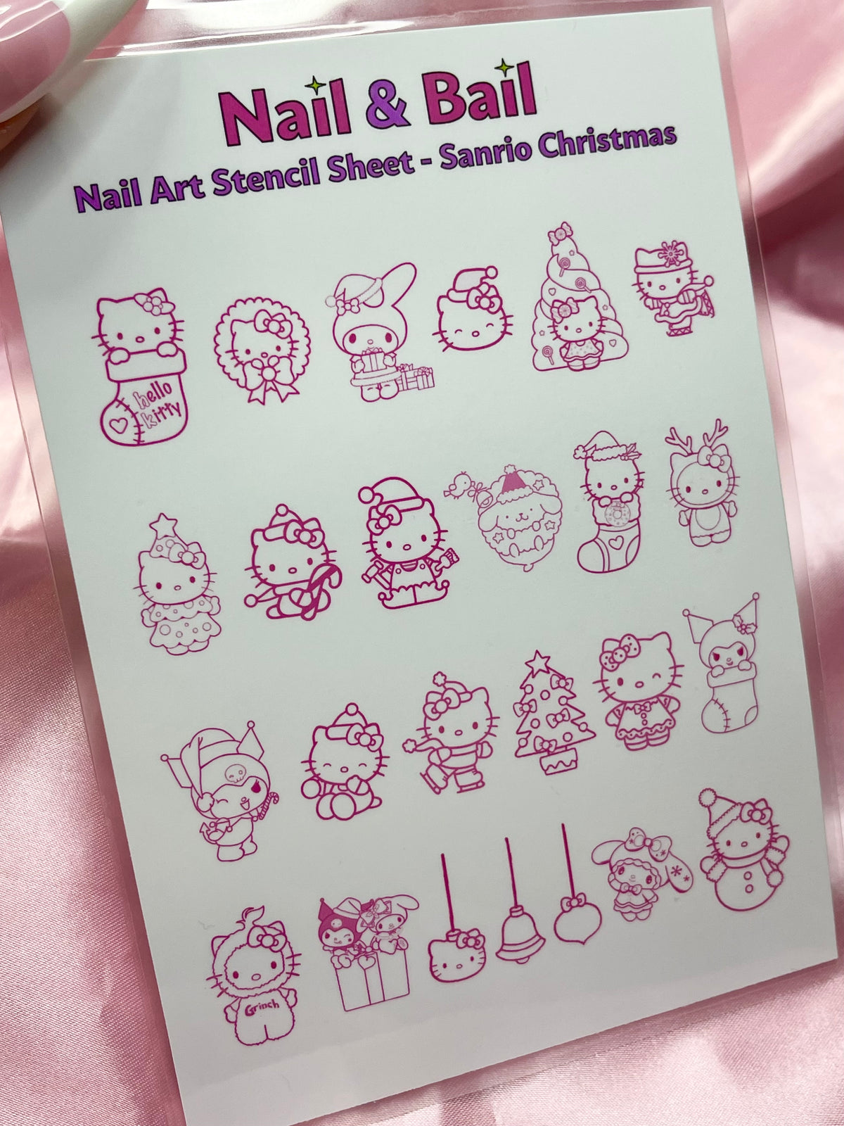 Create one-of-a-kind Sanrio-themed holiday nails with this festive nail art stencil sheet! With cute seasonal designs inspired by Hello Kitty and her friends, this Sanrio Christmas nail art stencil sheet will add a happy, holly-jolly accent to your look! Get your nails 'wrapped up' for the holiday season with this super cute design!