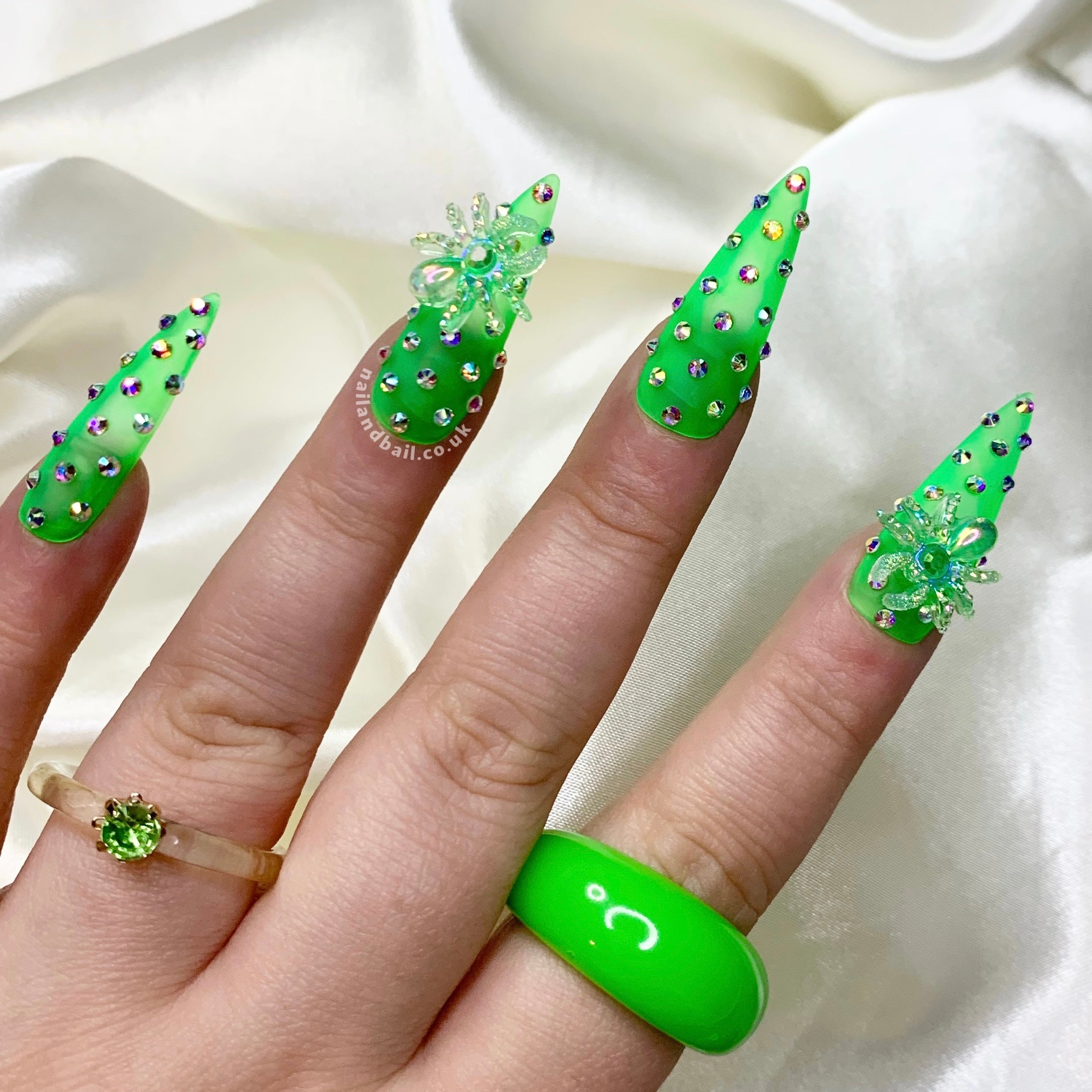 Green spider nail art on spooky matte Halloween press-on nails