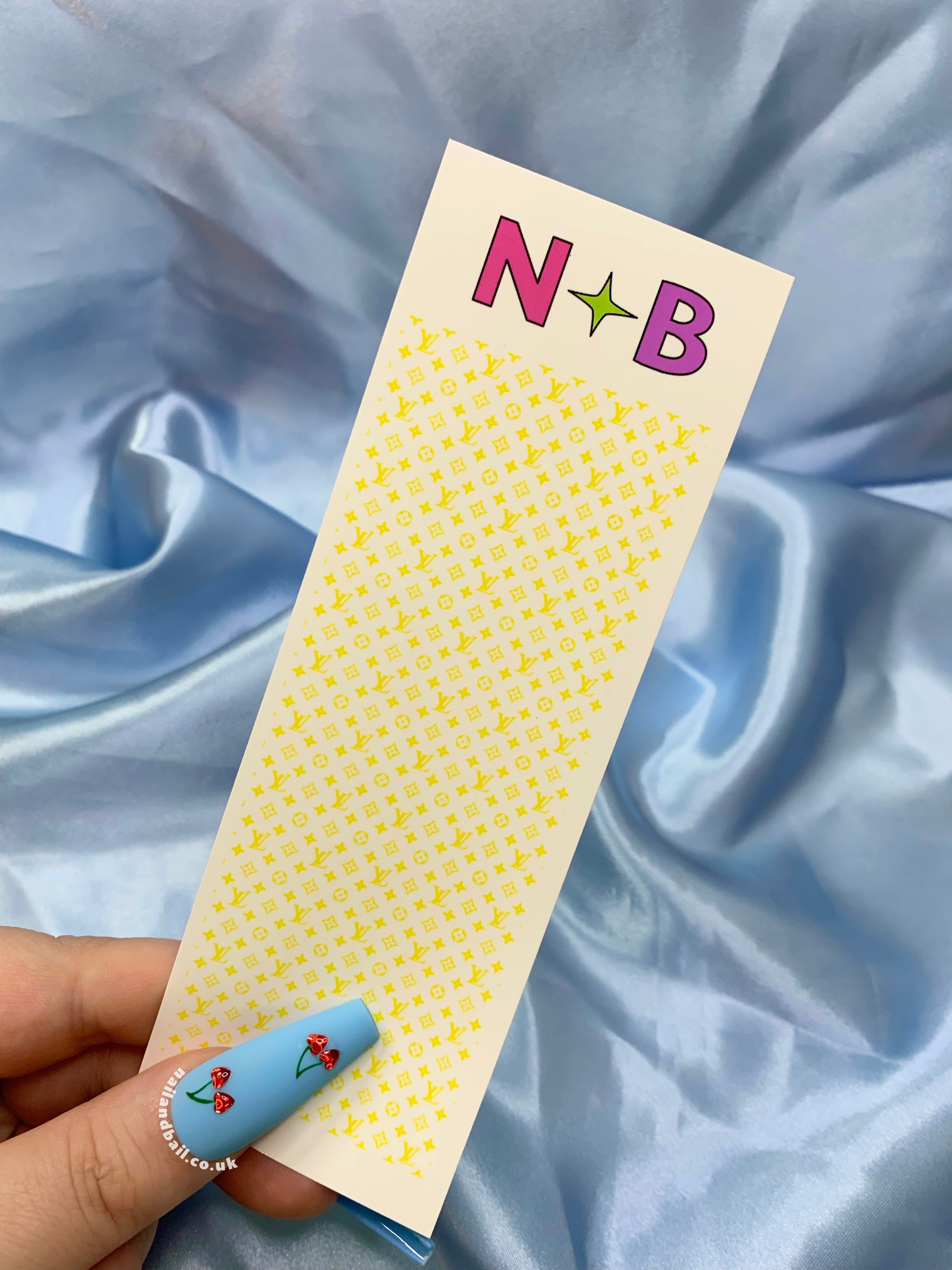 Elevate your nail game with our Bright Louis Vuitton Nail Decals, available in 6 enchanting colors: pink, green, purple, yellow, blue, and orange. Perfect for nail techs, these chic decals effortlessly add a touch of luxury to your nail art. Transform your nails into captivating canvases and let your creativity shine. Get ready to dazzle with Louis Vuitton style!