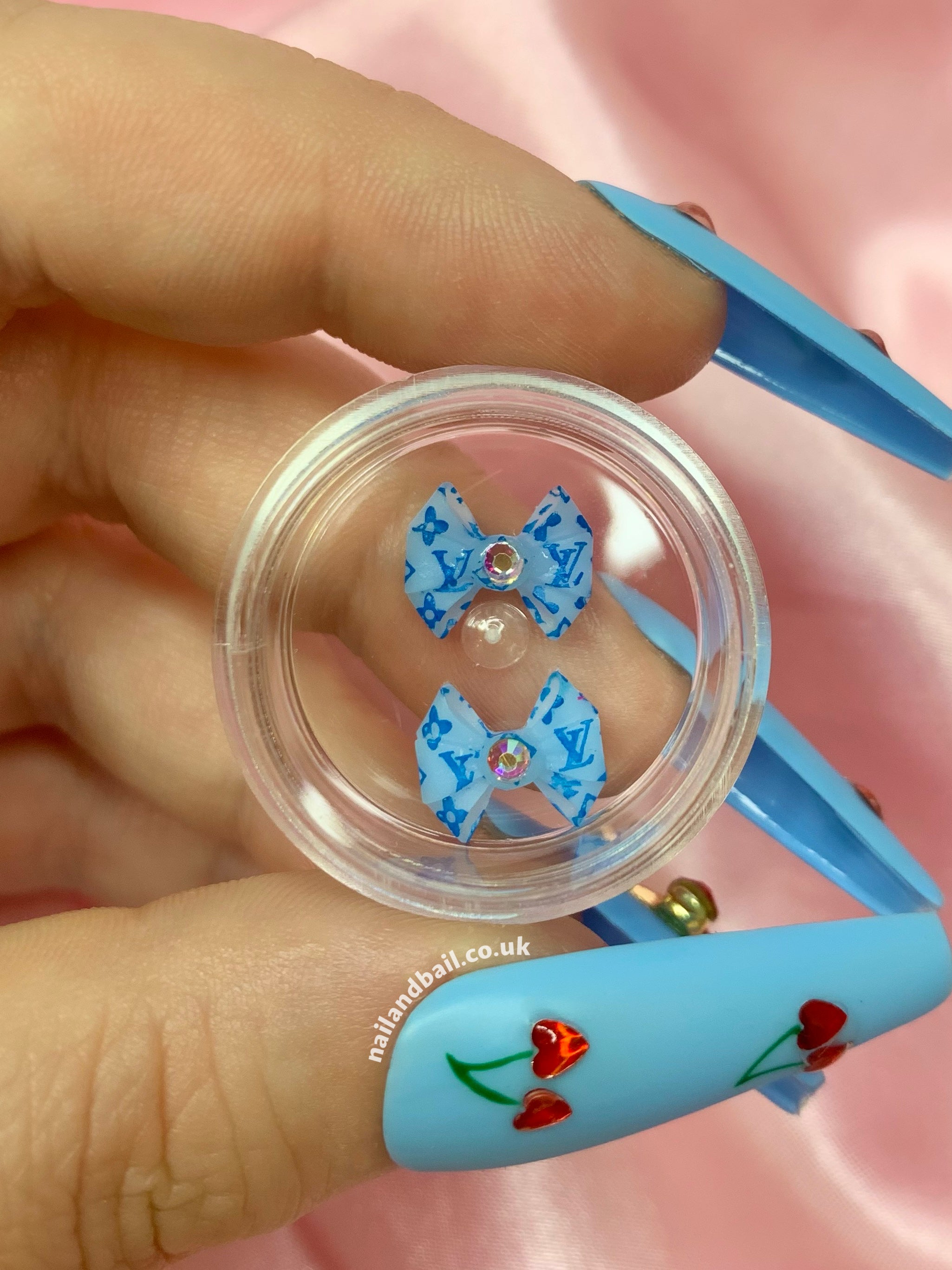 Introducing our absolutely adorable handmade Bright Louis Vuitton Bow Nail Charms, designed to add a touch of cuteness and sparkle to your nails! These charming little bows are the perfect accessory for any nail art enthusiast who loves all things girly.