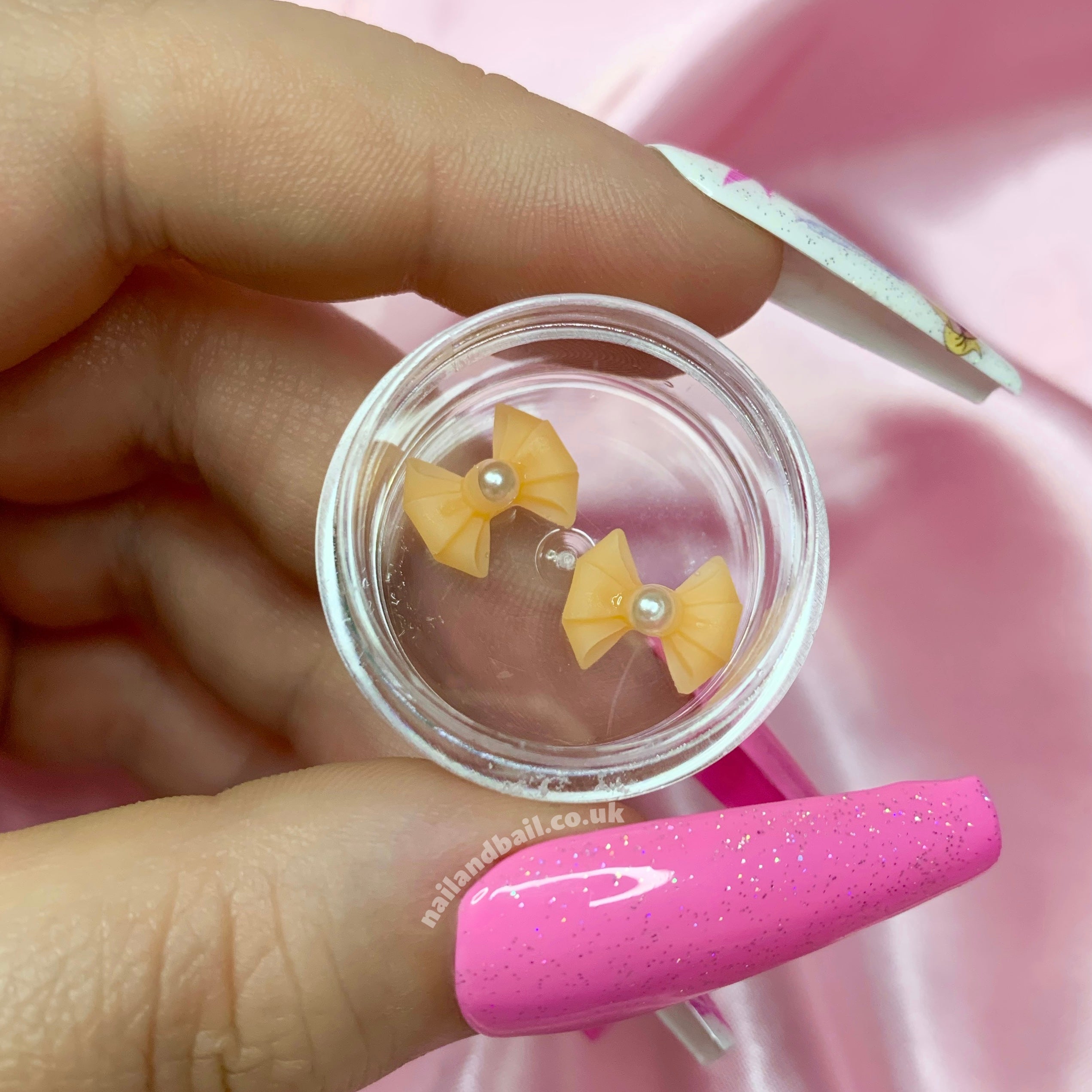 Introducing our adorable Handmade Pastel Pearl Bow Nail Charms, perfect for adding a touch of girly charm to your nails! These dainty nail charms are meticulously crafted with love and attention to detail, making them the must-have accessory for any nail enthusiast.