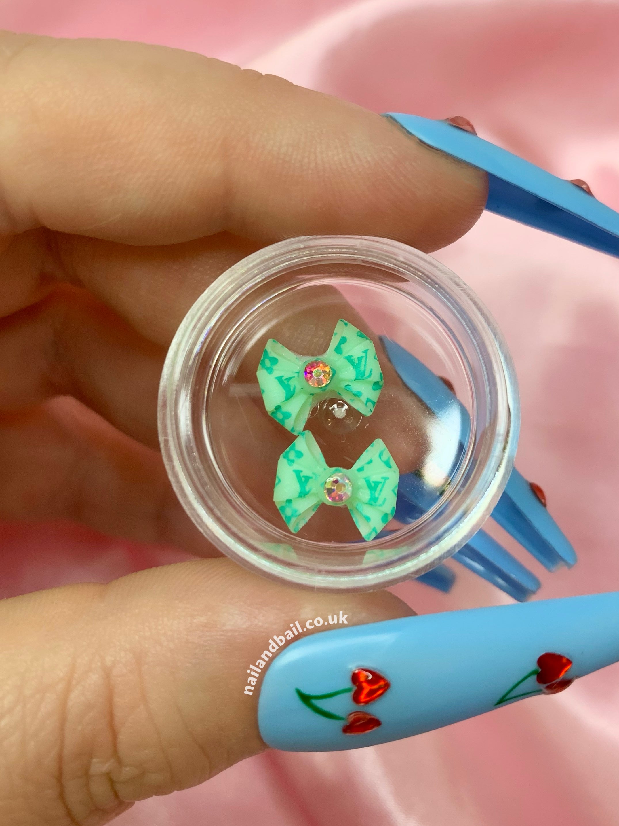 Introducing our absolutely adorable handmade Bright Louis Vuitton Bow Nail Charms, designed to add a touch of cuteness and sparkle to your nails! These charming little bows are the perfect accessory for any nail art enthusiast who loves all things girly.
