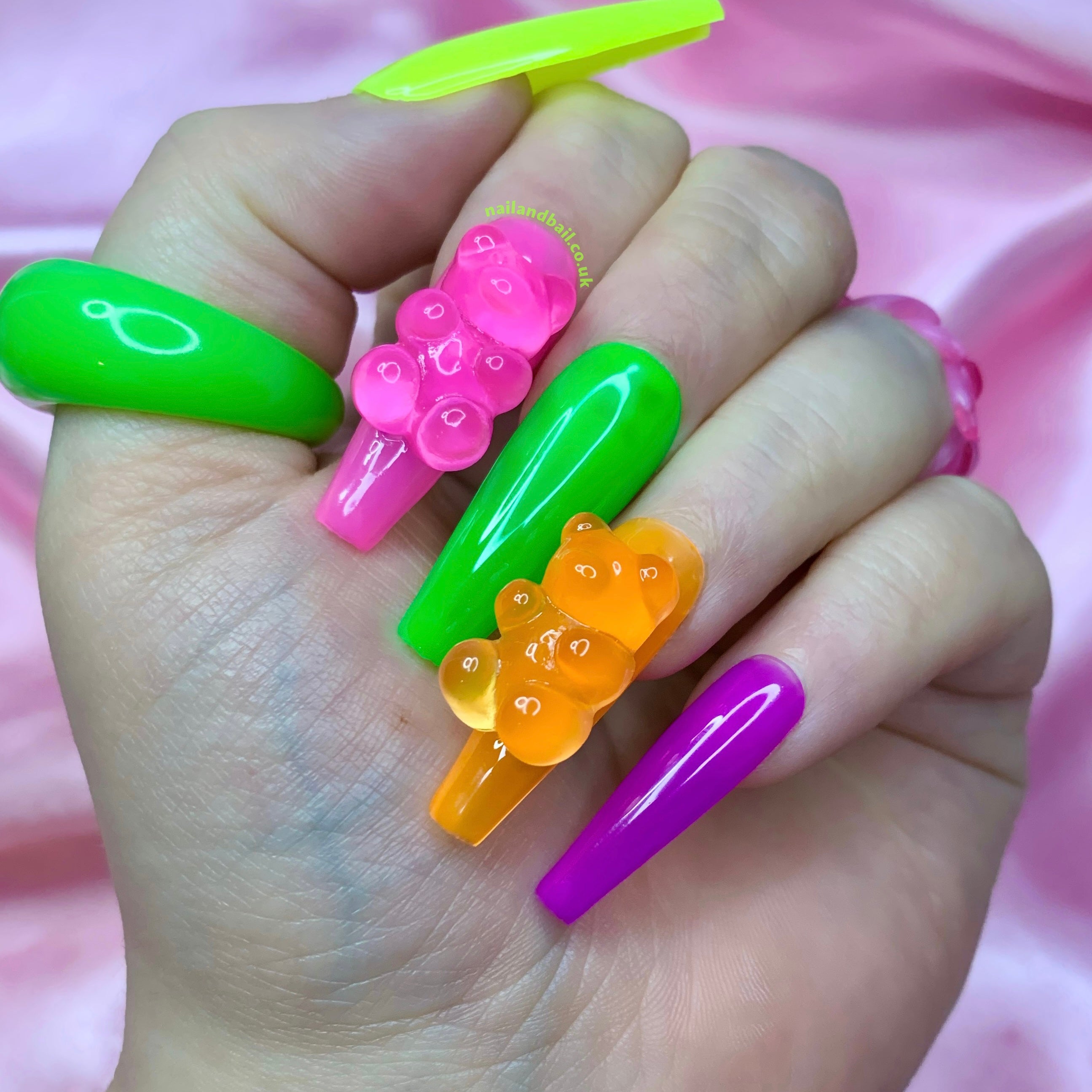 Colourful jelly press-on nails with translucent nail art and cute summer-inspired details