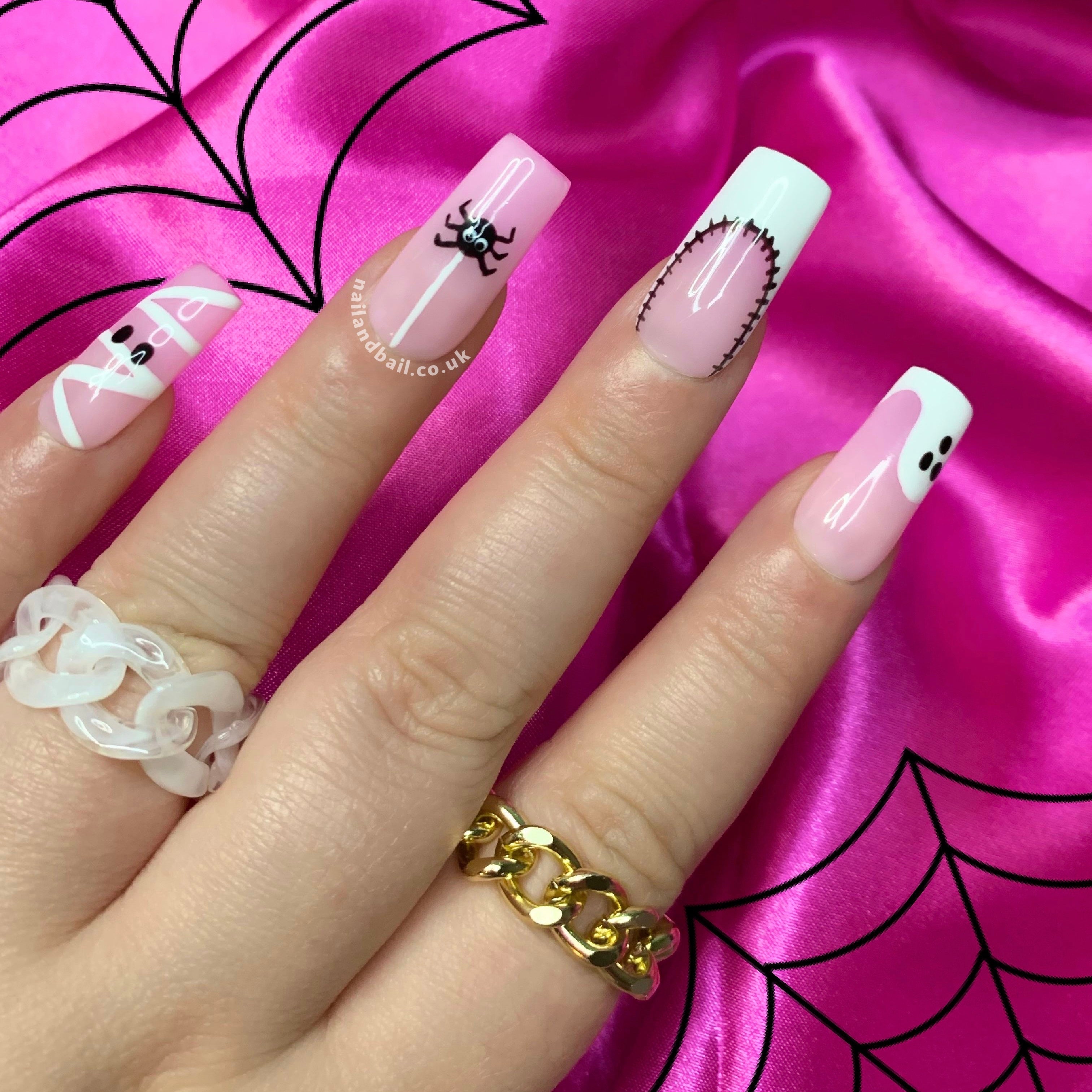 Hand-painted mummy nail art on spooky Halloween press-on nails