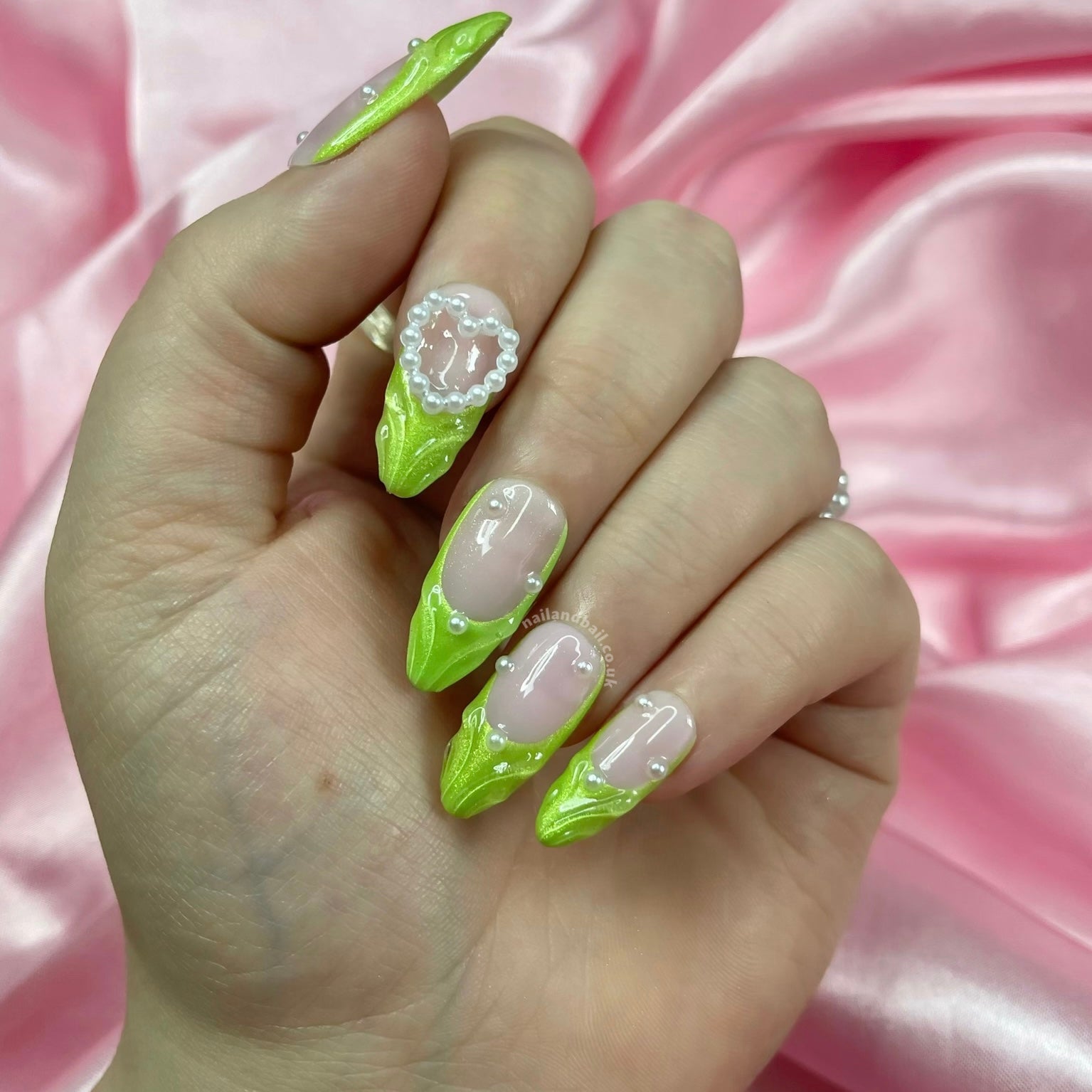 Pearl nail art on green shimmer fairy-inspired press-on nails