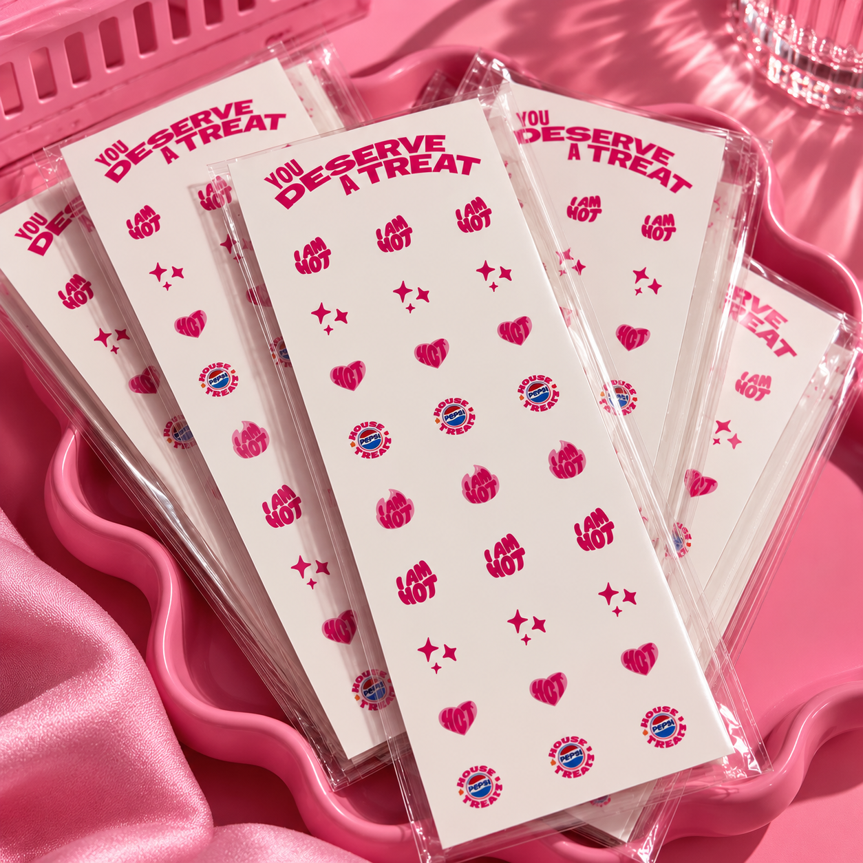 Multiple custom Pepsi branded nail decal sheets packaged and ready for an event