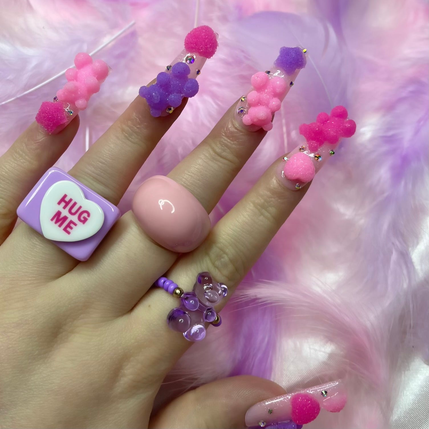 Silver crystal nail art on glossy pink shimmer press-on nails