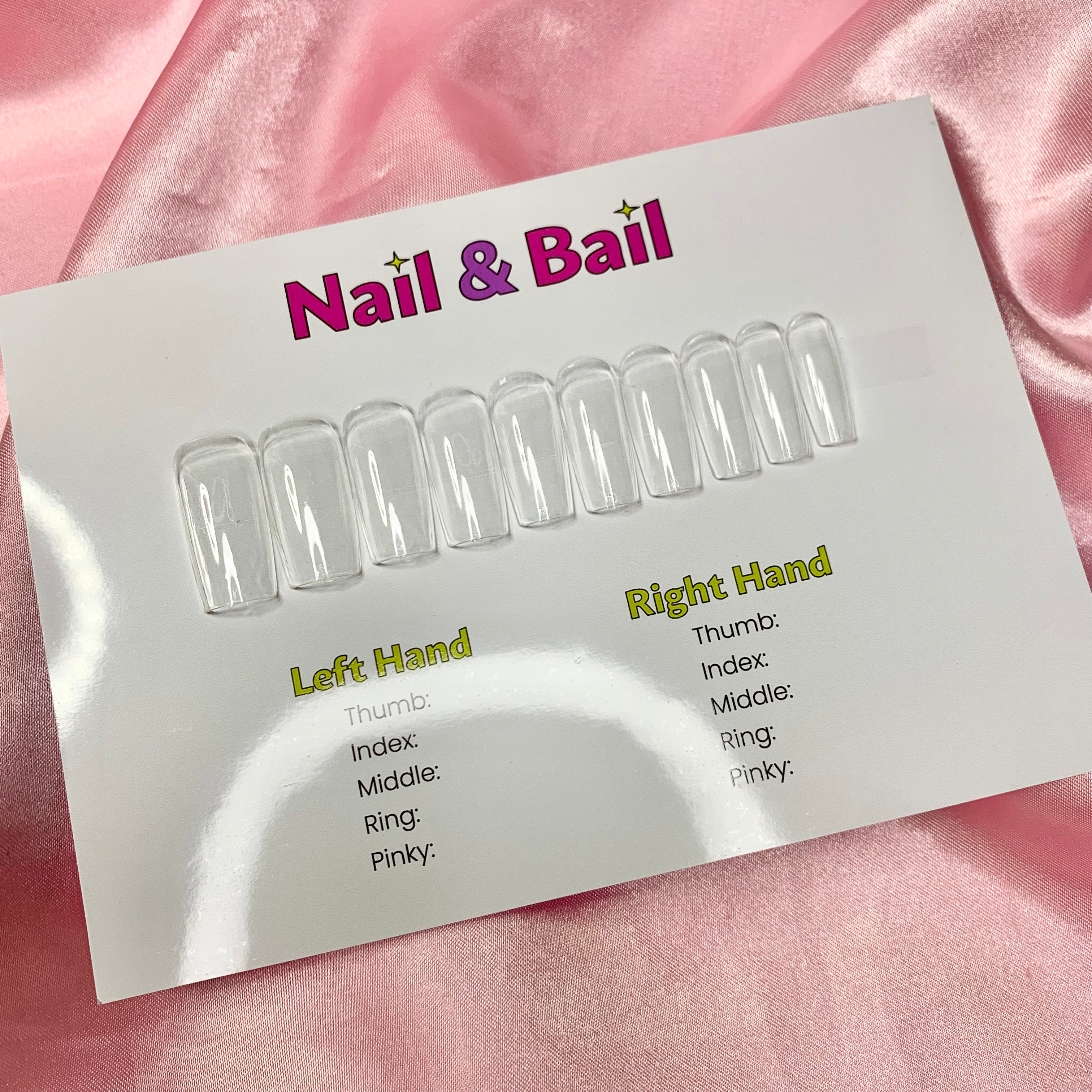Press-on nail sizing kit with numbered sample nails and sizing instructions card