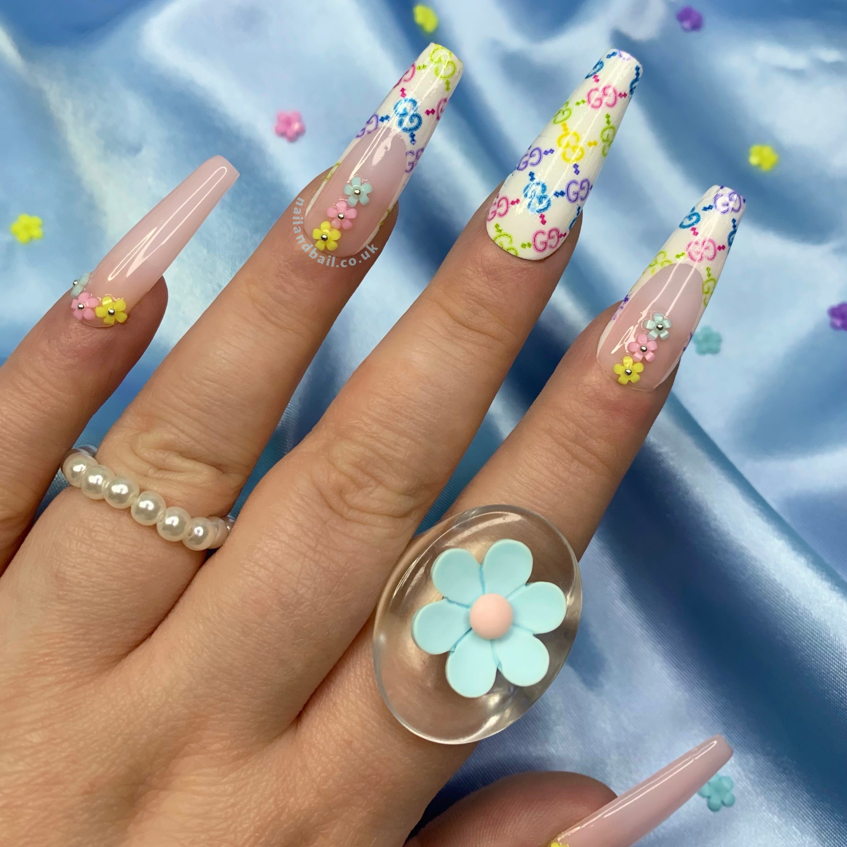 3D flower nail art on colourful designer-inspired press-on nails