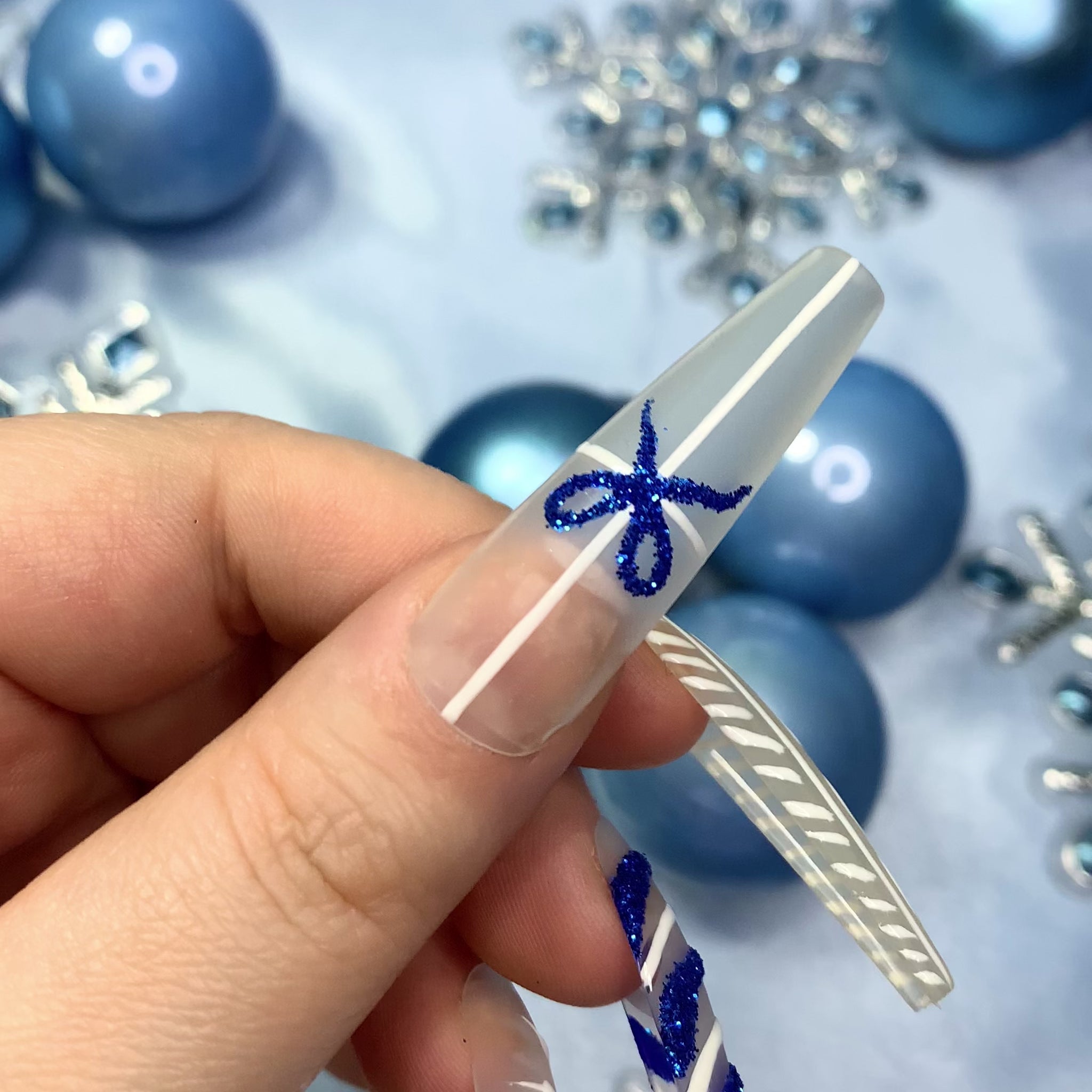 Clear matte, white & blue glitter winter press on nails. Perfect for the Christmas and winter season.