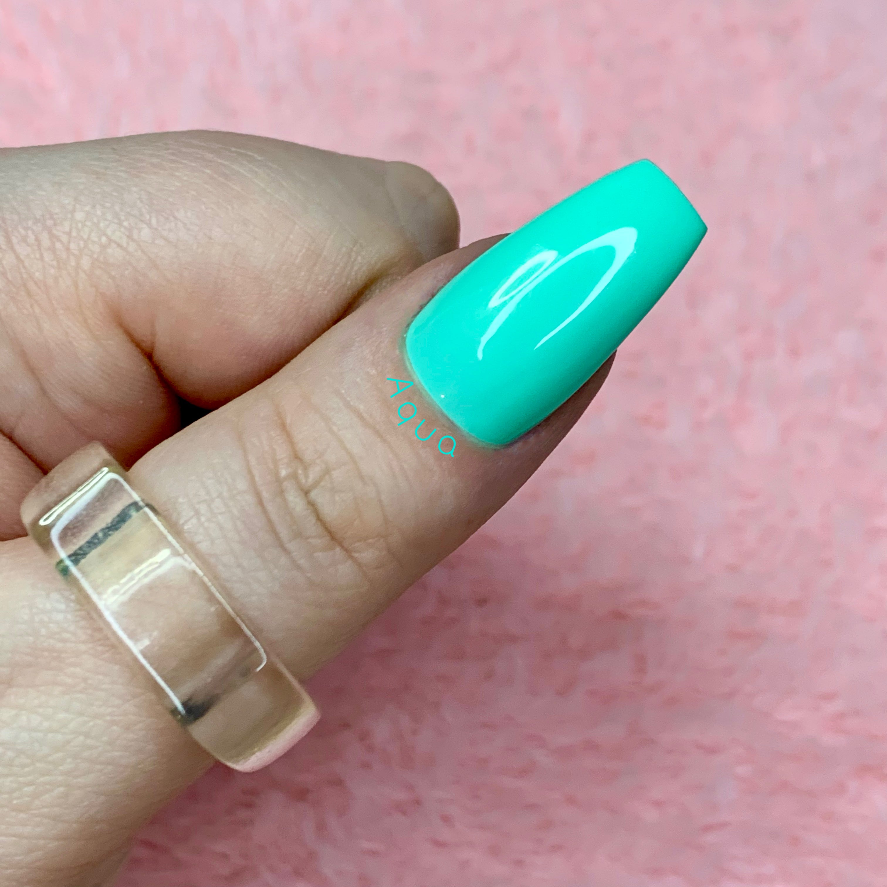 Aqua teal green glossy press-on nails inspired by tropical waters and spring colours