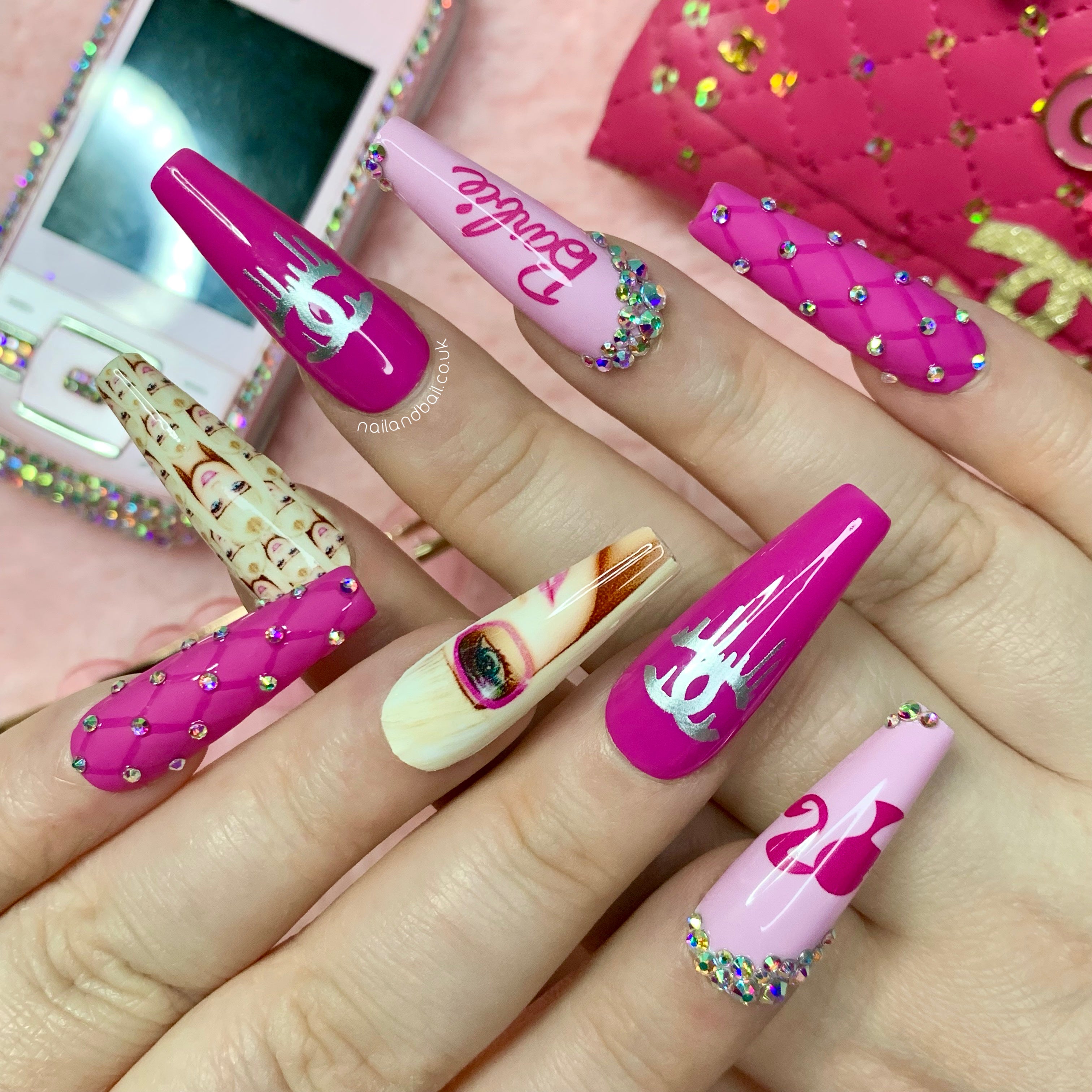 Barbie-inspired silhouette and logo nail art on pink Y2K press-on nails