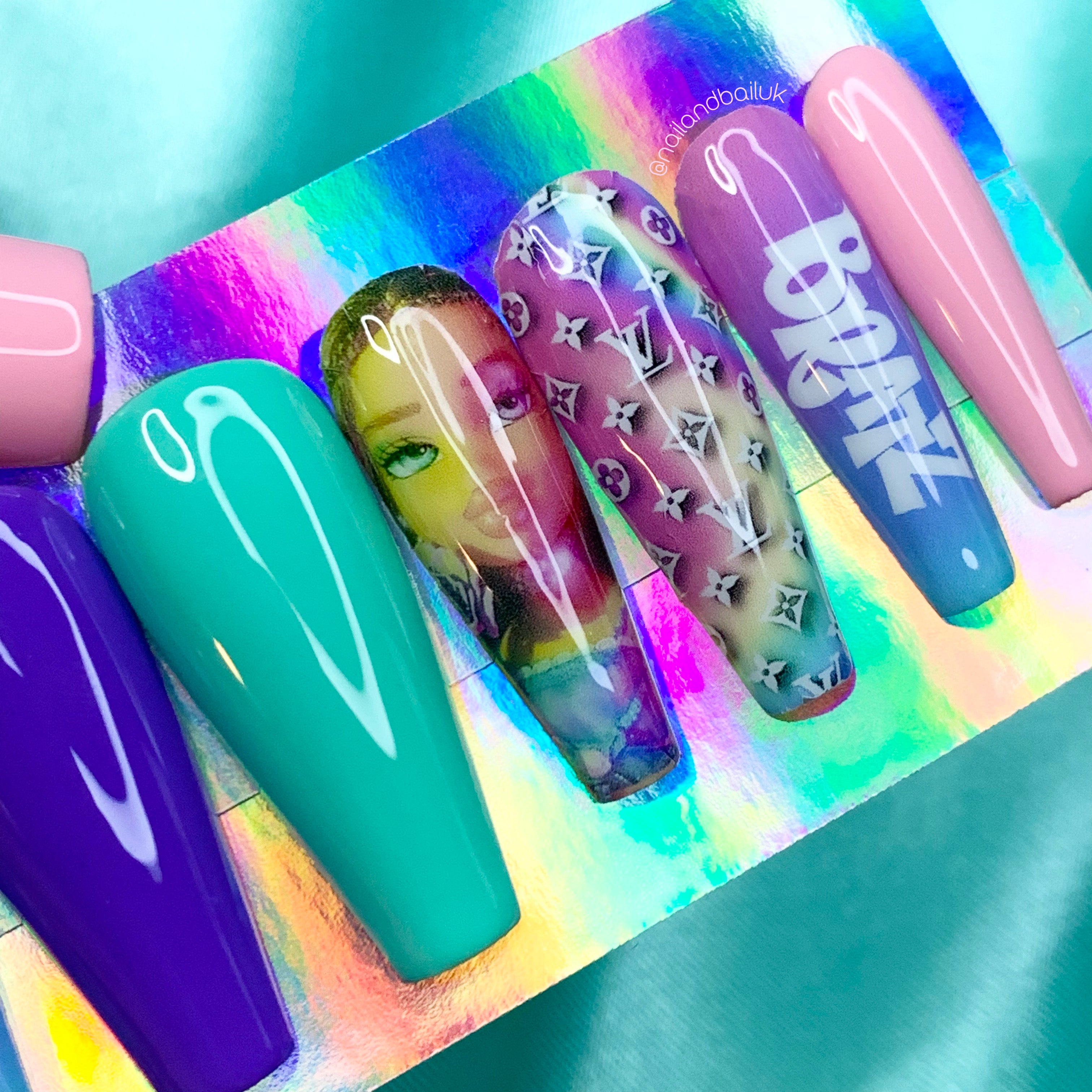 Bratz-inspired logo nail art on pink and blue ombré press-on nails