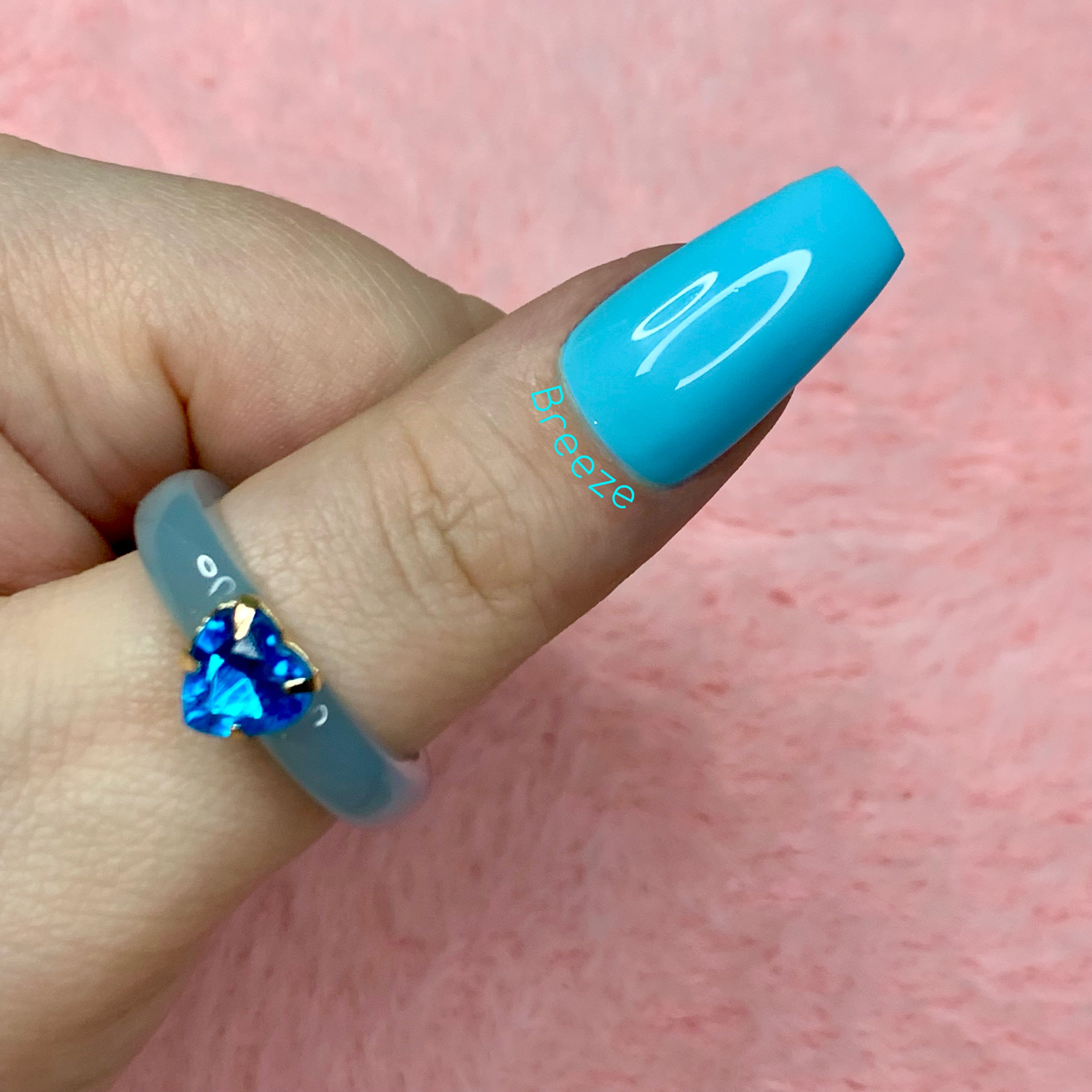 Breeze light blue glossy press-on nails with a fresh spring-inspired finish