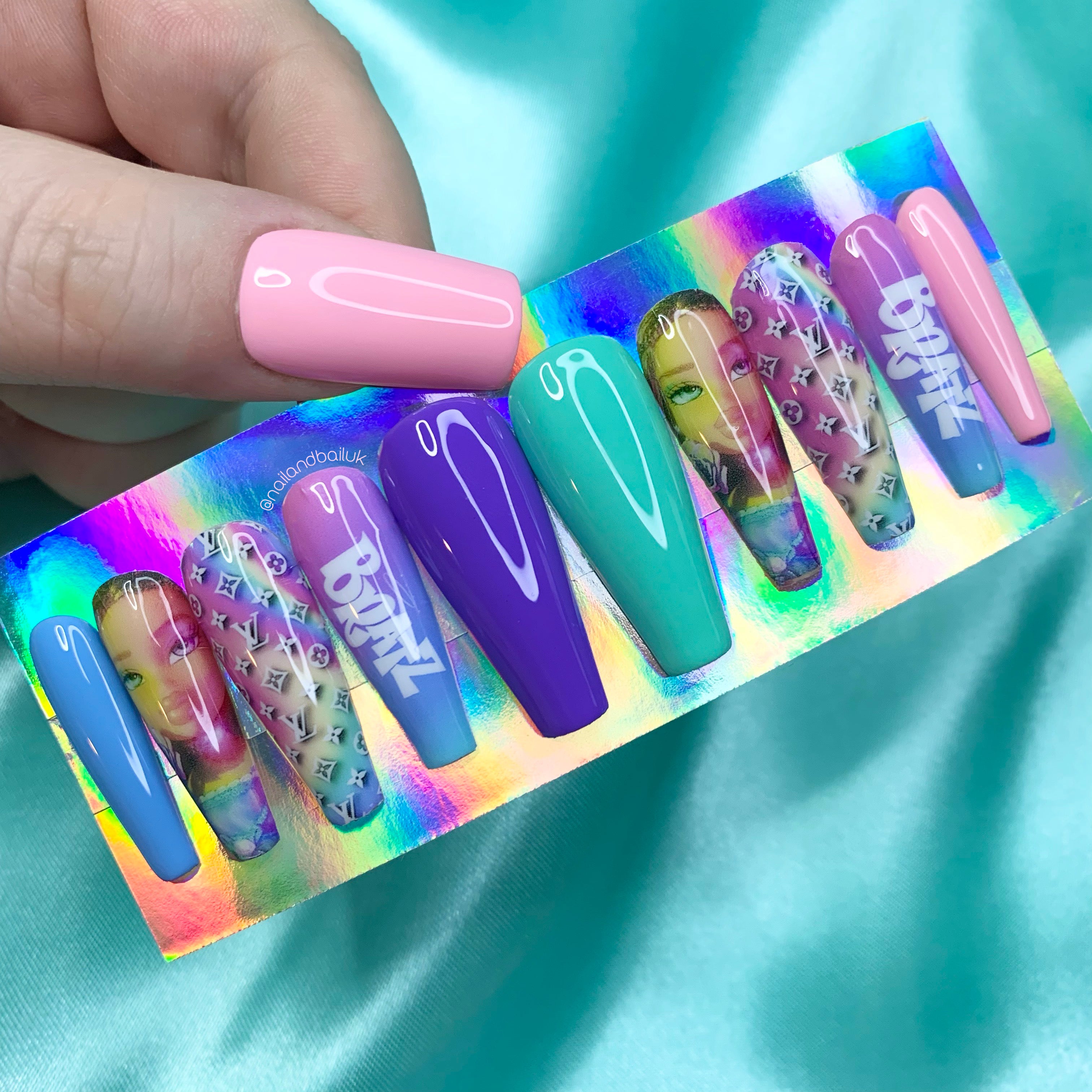 Colourful Y2K press-on nails with ombré nail art, Bratz-inspired details, and luxury-inspired prints