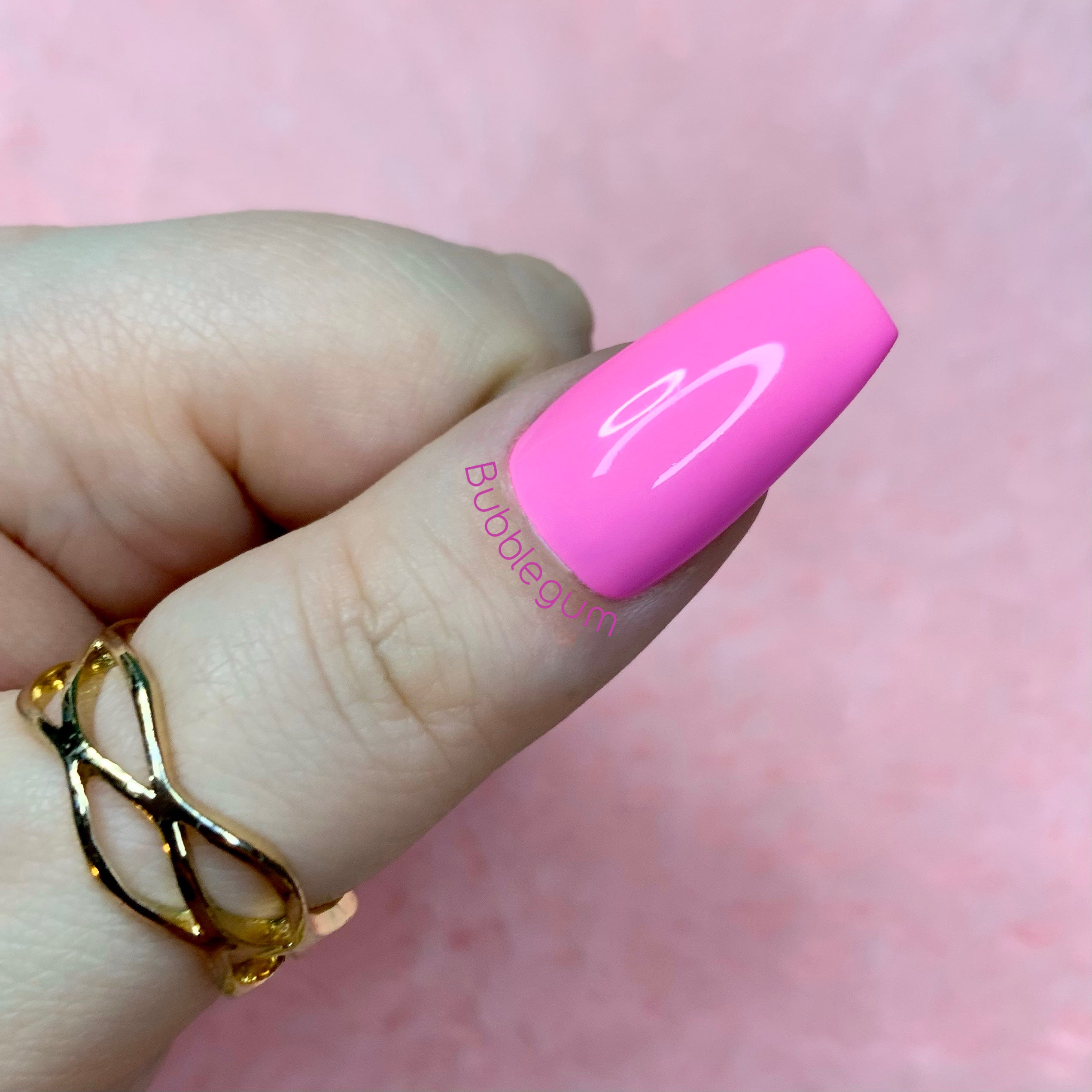 Bubblegum pink glossy press-on nails with a playful feminine finish