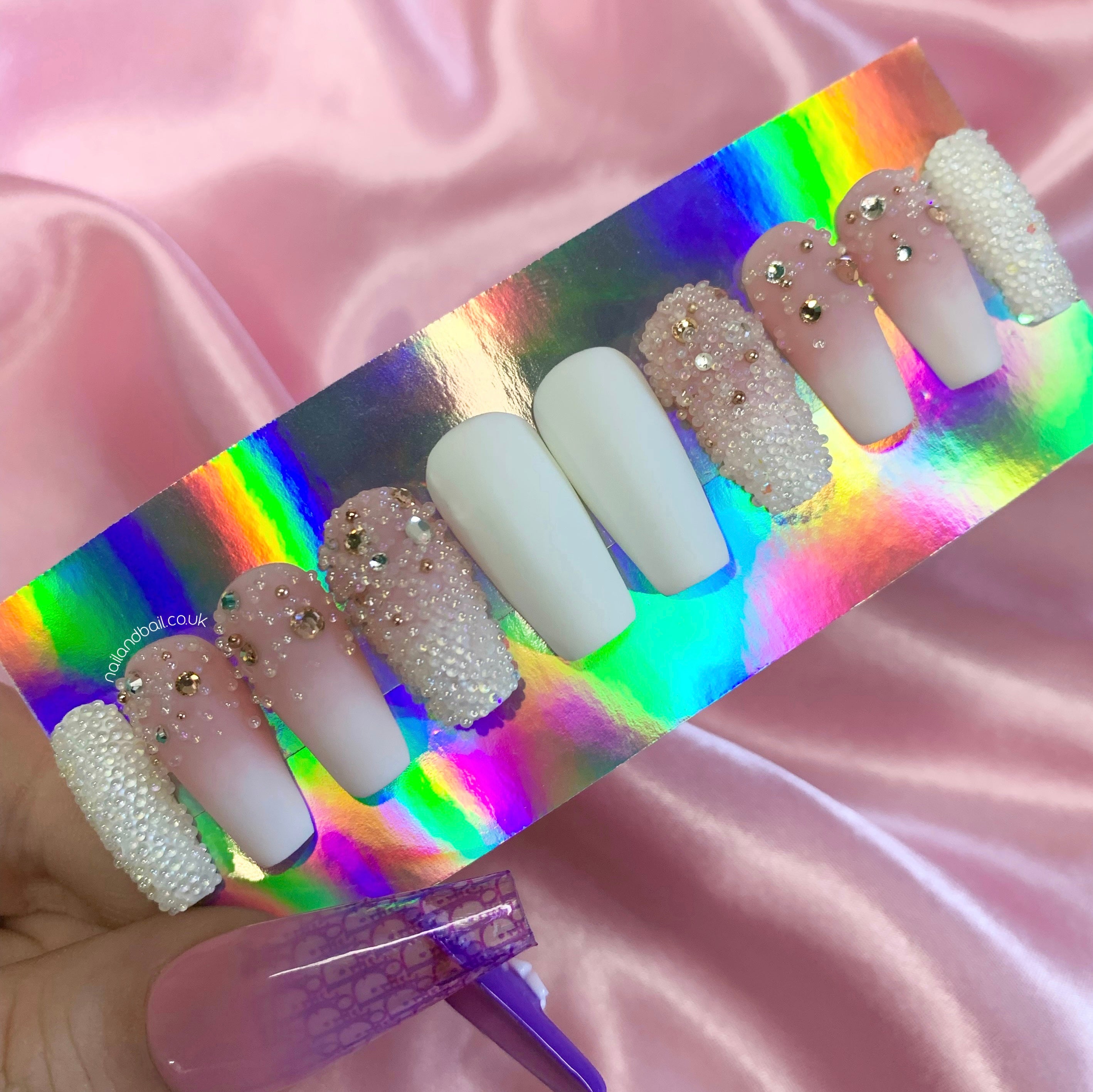 Matte white and pink ombré press-on nails with champagne crystals and clear bead embellishments
