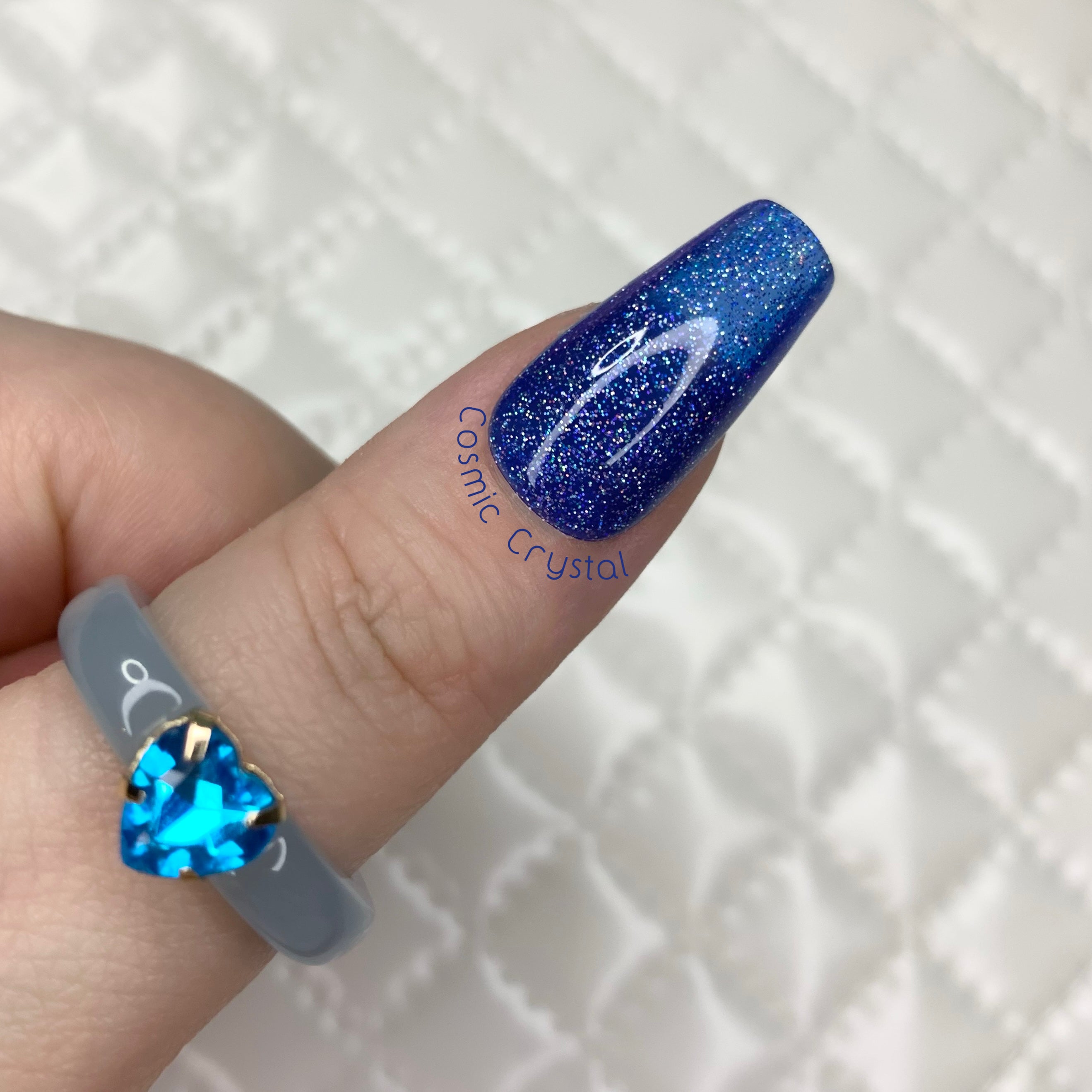 Cosmic Crystal jelly press-on nails with deep blue holographic glitter finish