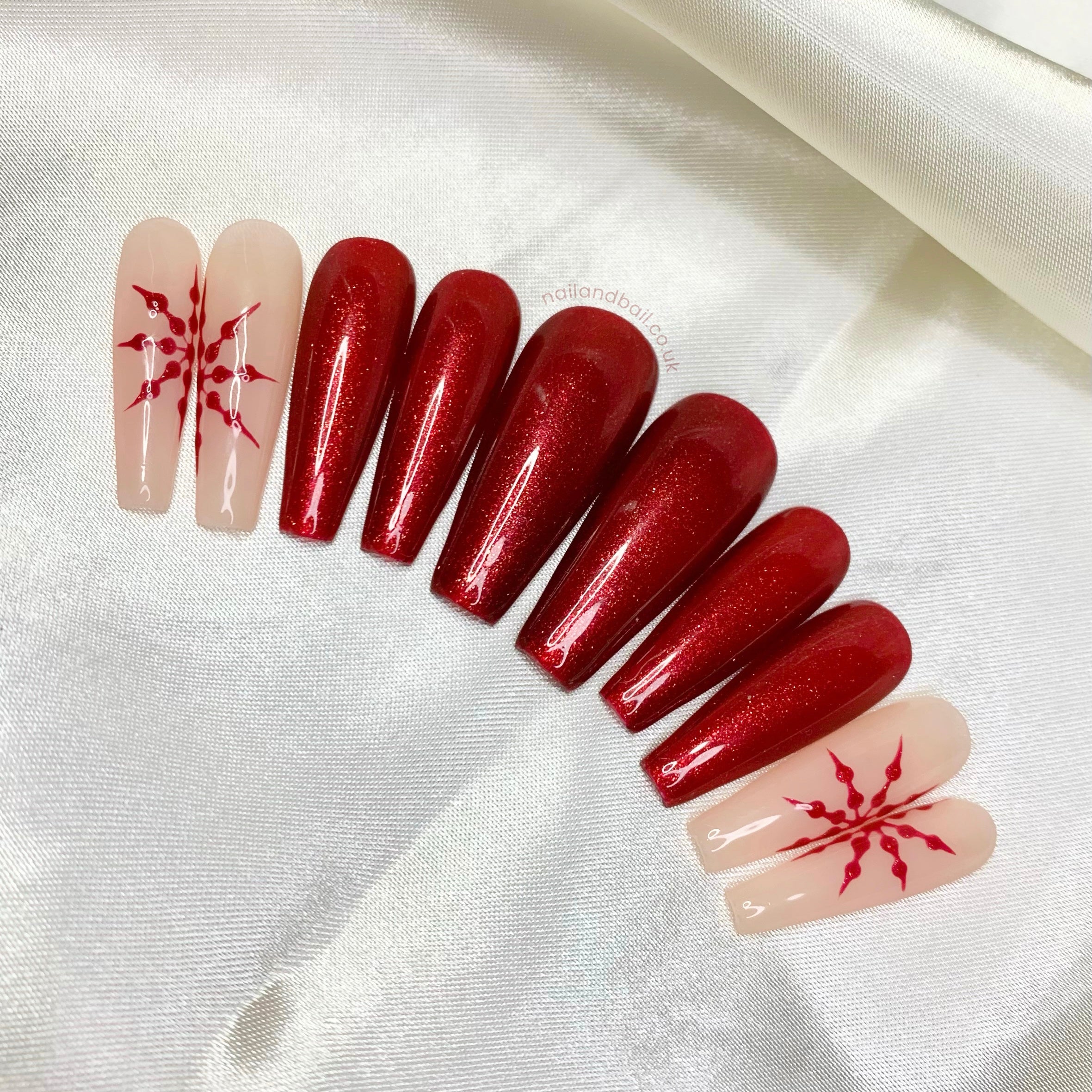 Deep red glitter press-on nails with festive Christmas sparkle