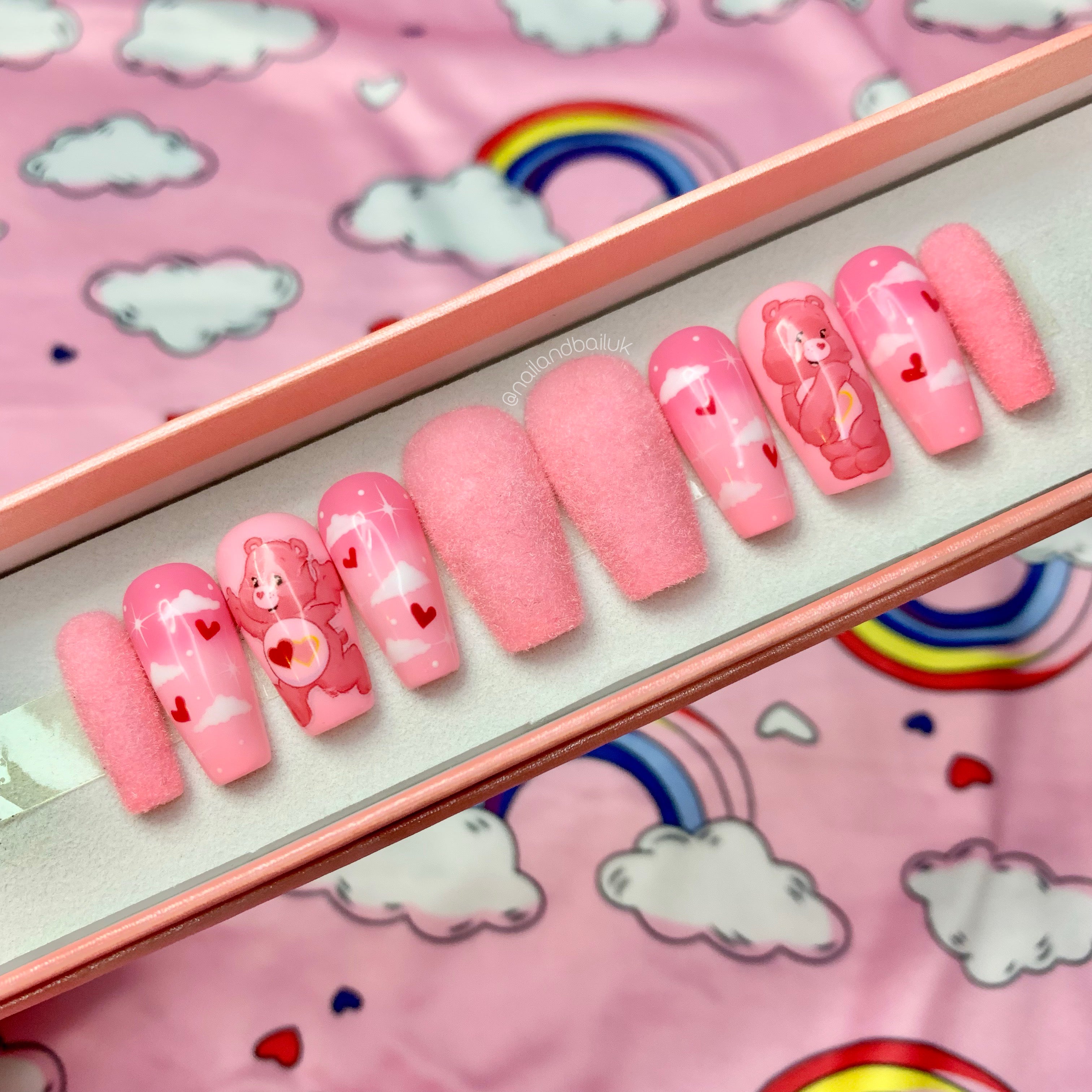 Baby pink faux fur press-on nails with nostalgic character-inspired nail art