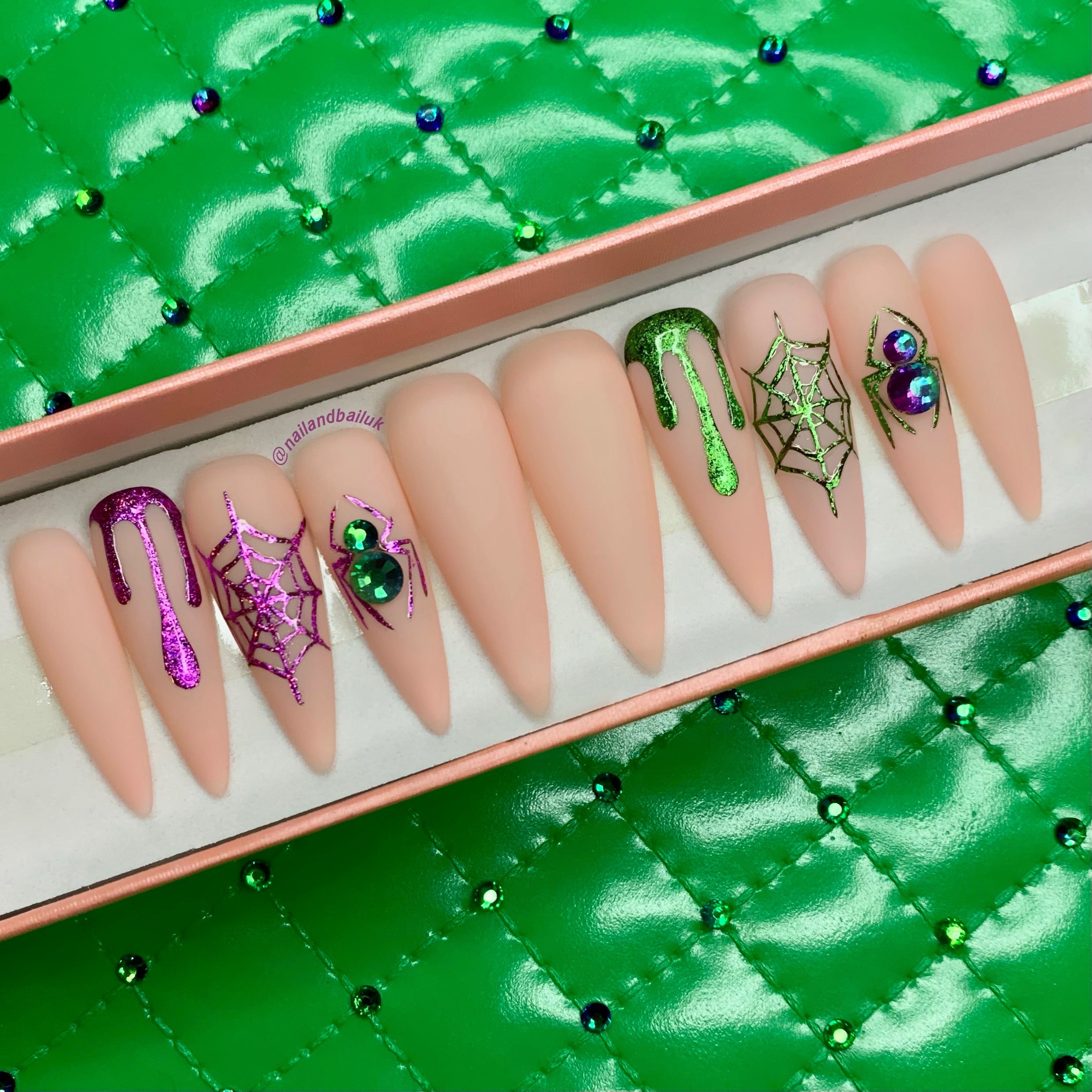 Introducing "Bad & Boo-jee" Press-On Nails – where spooky meets chic in seconds! These nails boast matte nude bases adorned with hand-painted purple and green chrome drips, spider webs, and crystal-studded spiders. It's Halloween glam at its finest! Get ready to turn heads and captivate with these instant statement-makers. Order now and let your nails do the talking! 💅🕷️🕸️