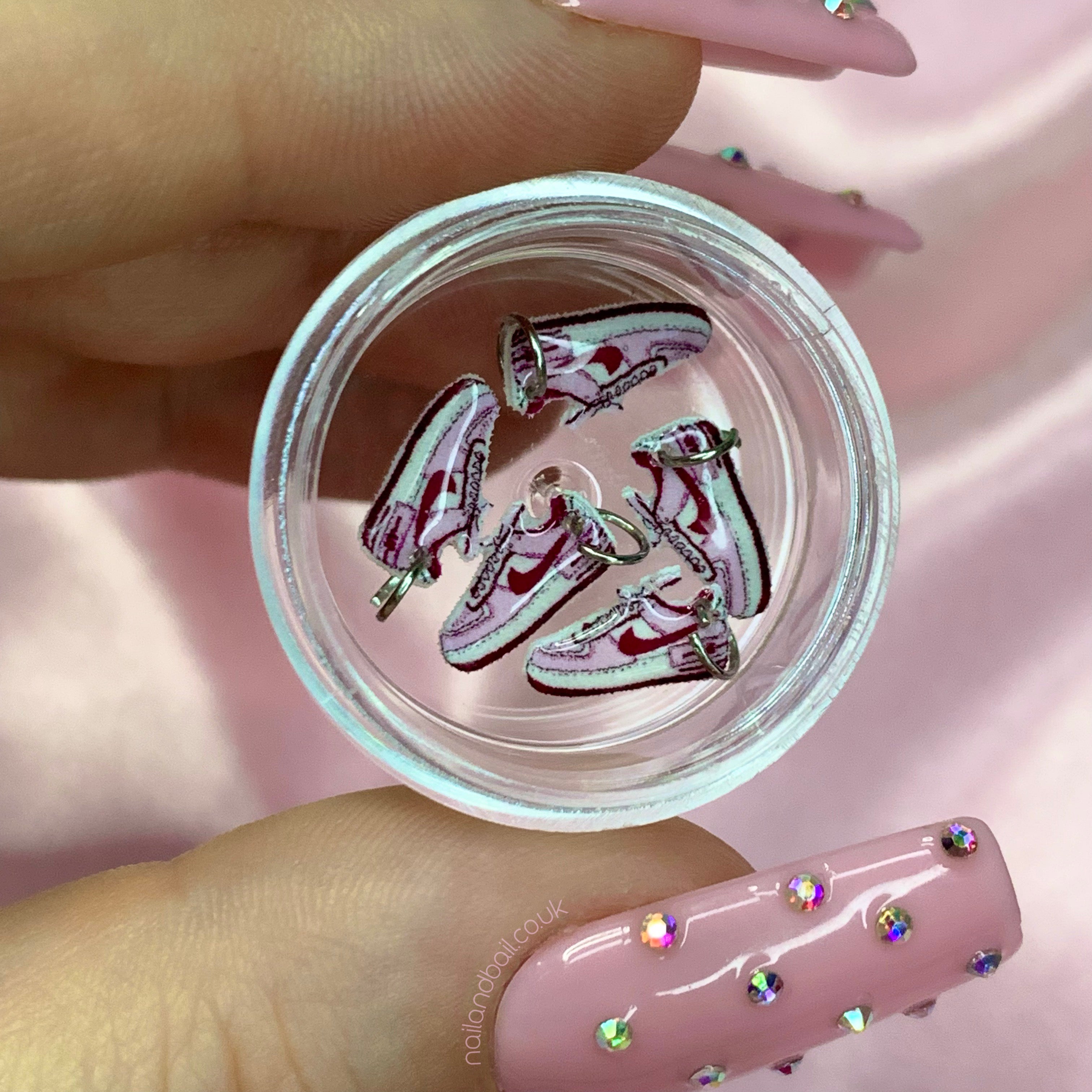 Introducing our exquisite handmade Nike sneaker nail charms - the perfect accessory to take your nail game to the next level! Crafted with attention to detail, these six charms feature miniature versions of iconic Nike sneakers, adding a touch of sporty flair to your manicure. Whether you're a sneakerhead or simply appreciate unique nail art, these charms are a must-have.