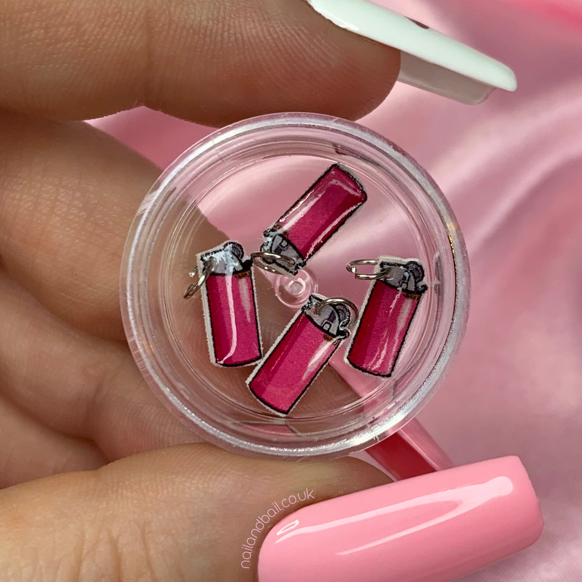 Looking for the cutest addition to your nail art collection? Look no further, hun! Our pink lighter nail art charms are the perfect way to add a touch of girly glam to your next manicure. These little beauties are sure to light up your world and have you feeling extra fabulous. Don't miss out on this must-have accessory for your next nail sesh!