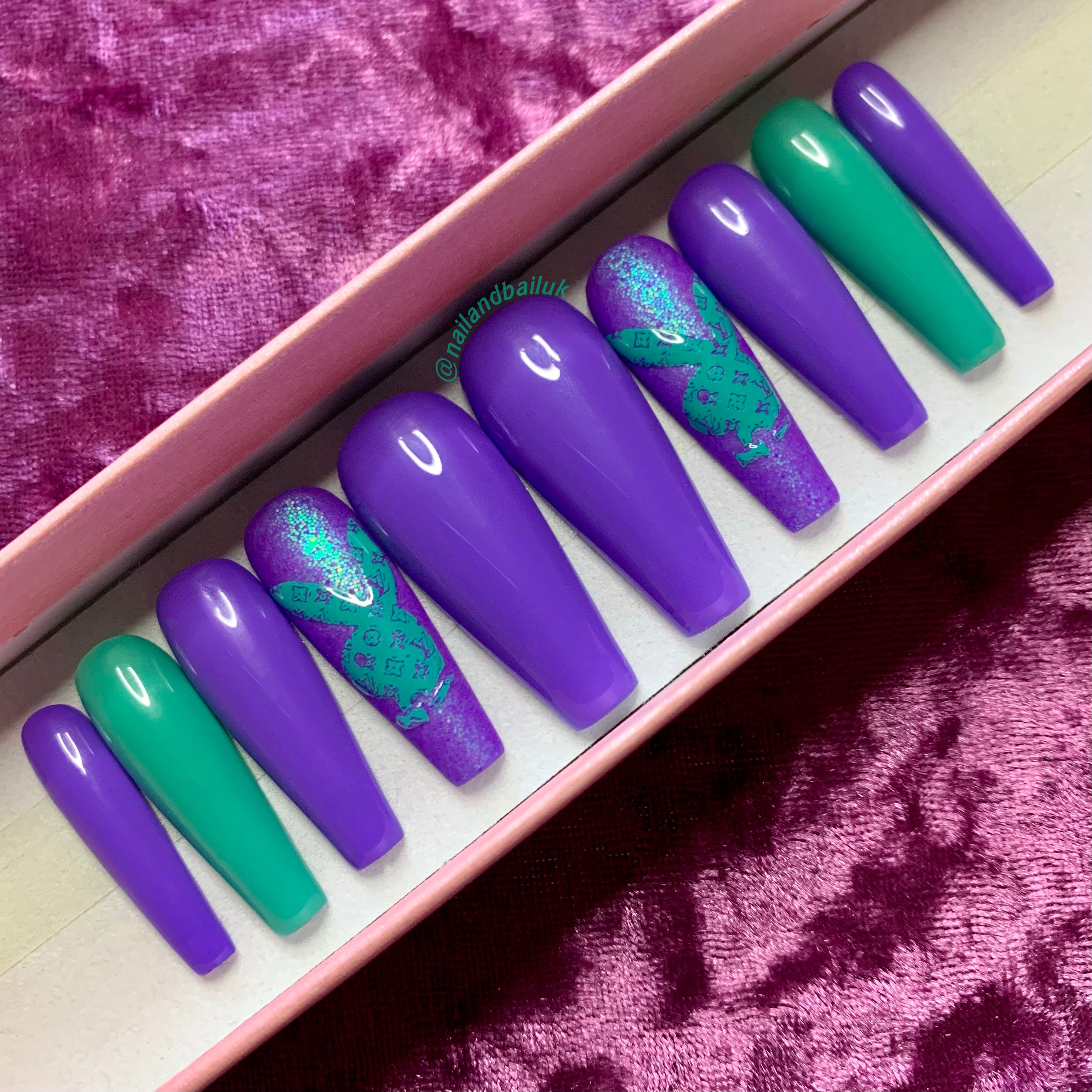 Matte purple glitter press-on nails with green shimmer and glossy green accent nails