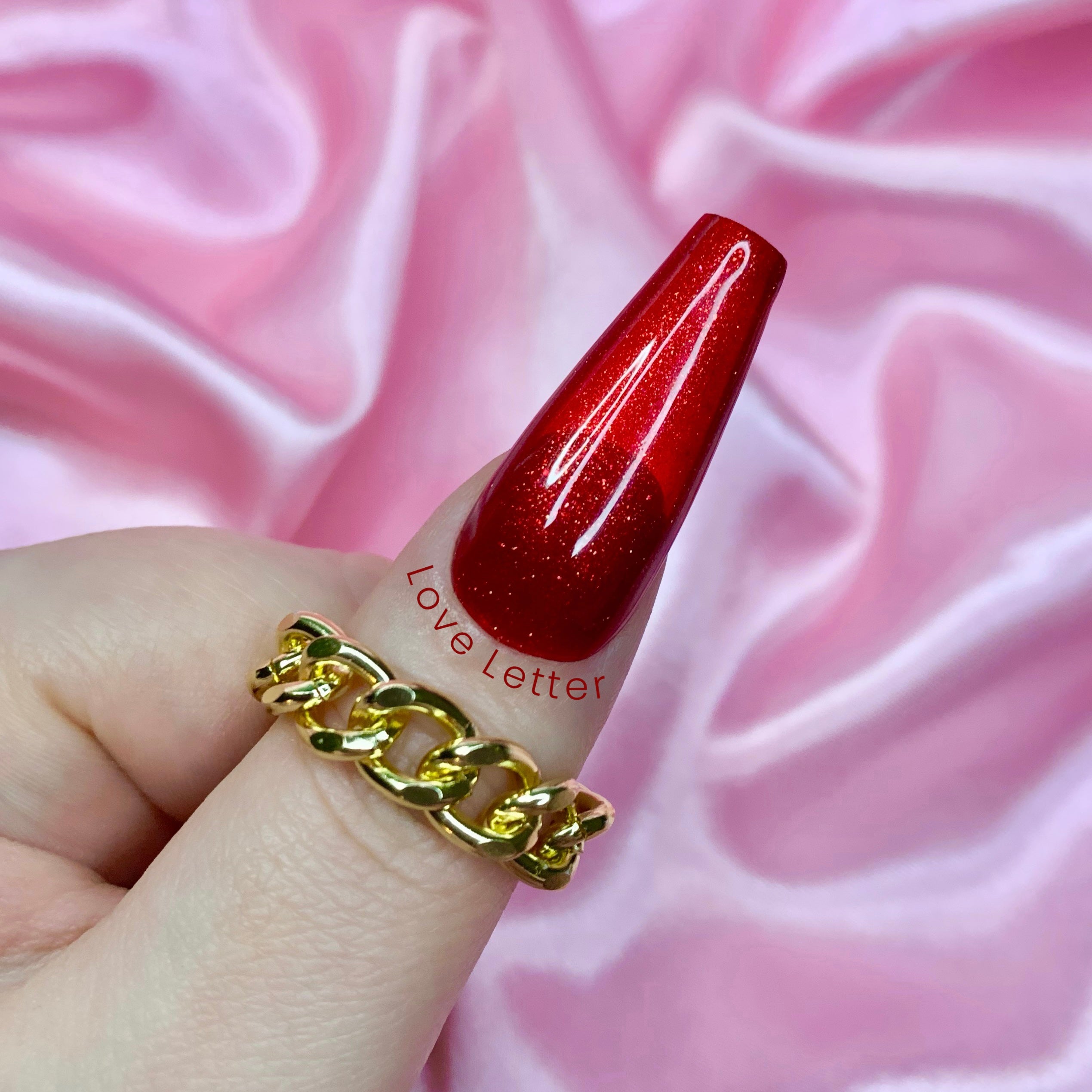 Red plain glitter press-on nails for Valentine’s Day with glossy durable finish