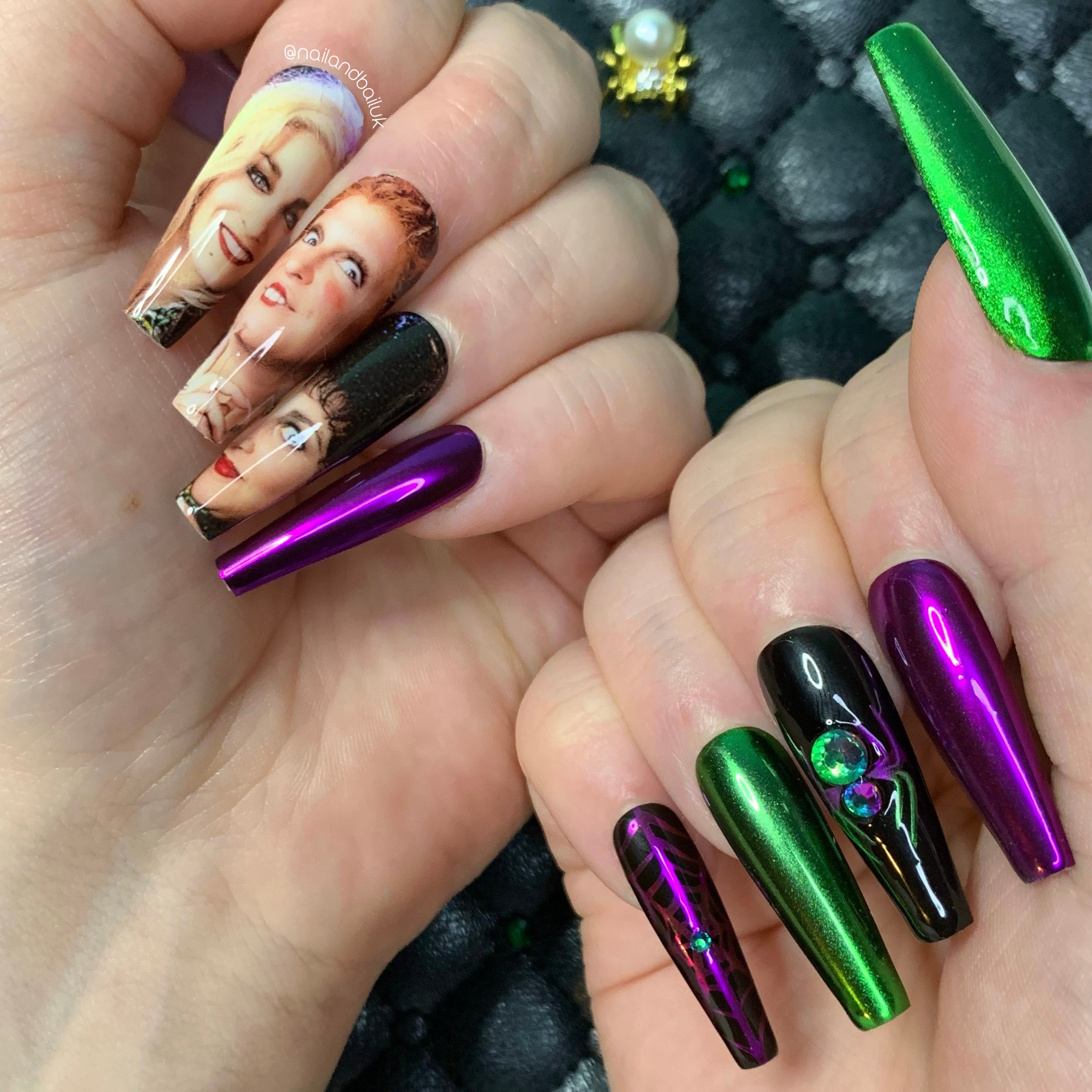 Black, green, and purple chrome Halloween press-on nails with witch-inspired nail art and crystal spider details