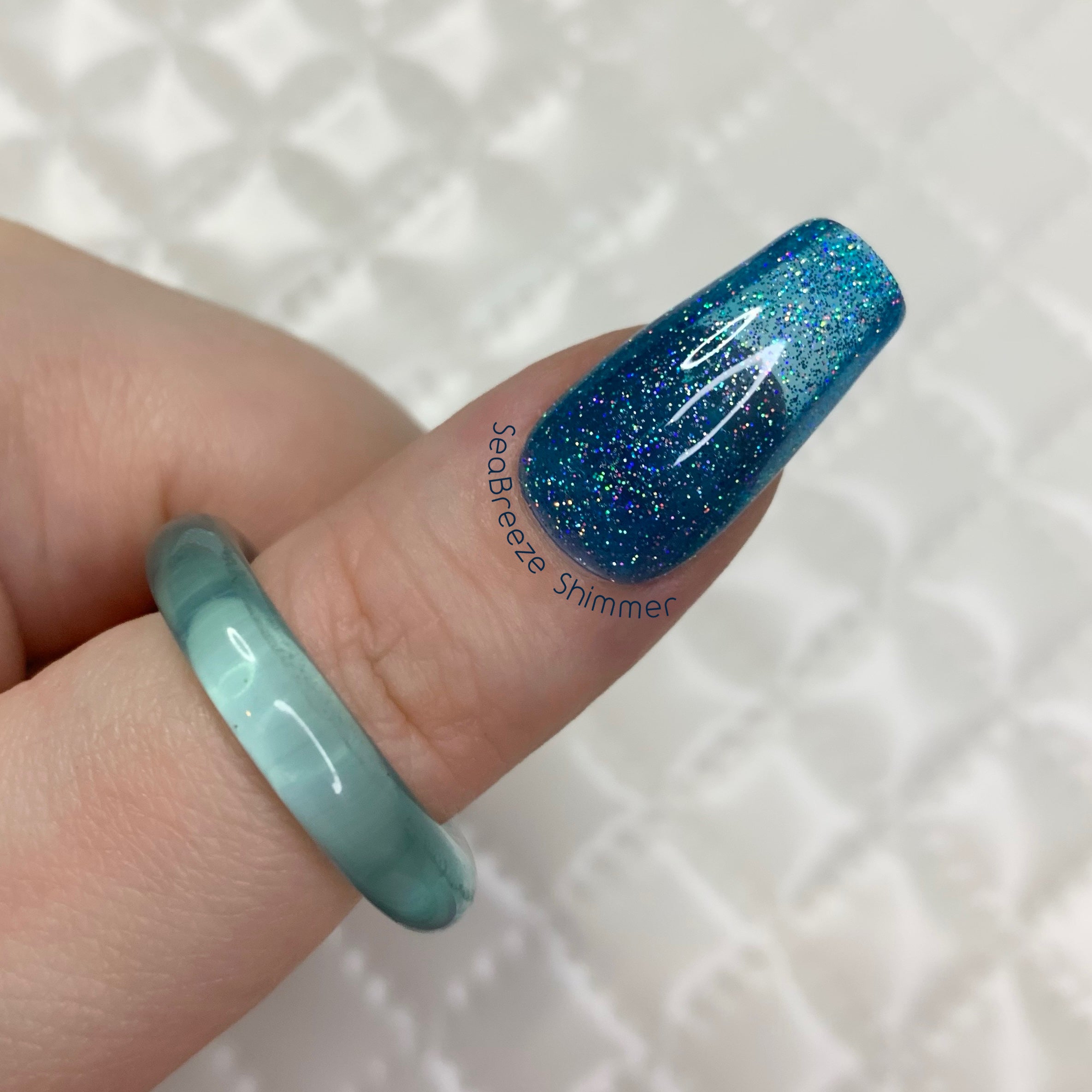 Sea Breeze Shimmer jelly press-on nails with ocean blue holographic glitter finish