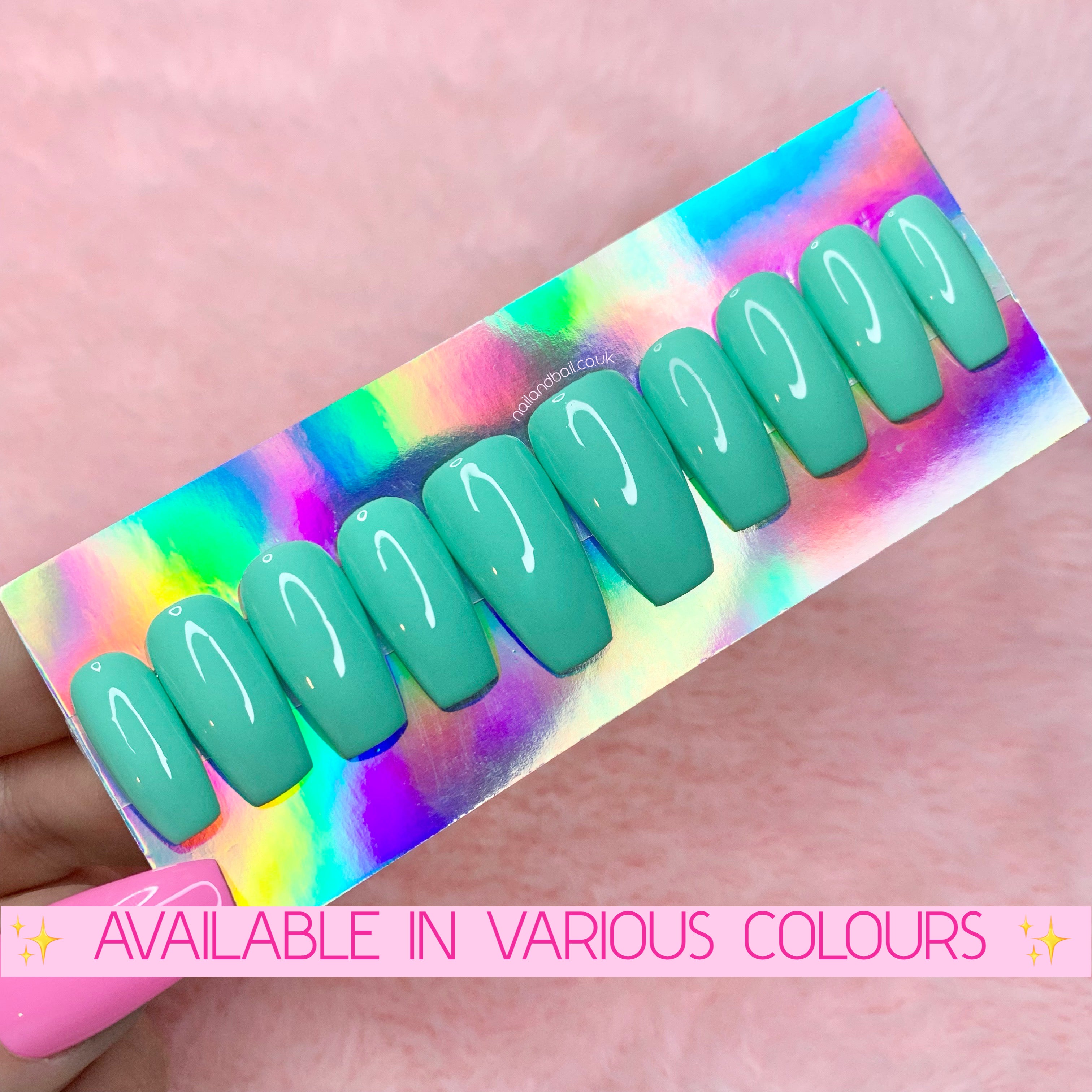 Colourful spring press-on nails available in blue, yellow, purple, teal, and pink glossy finishes