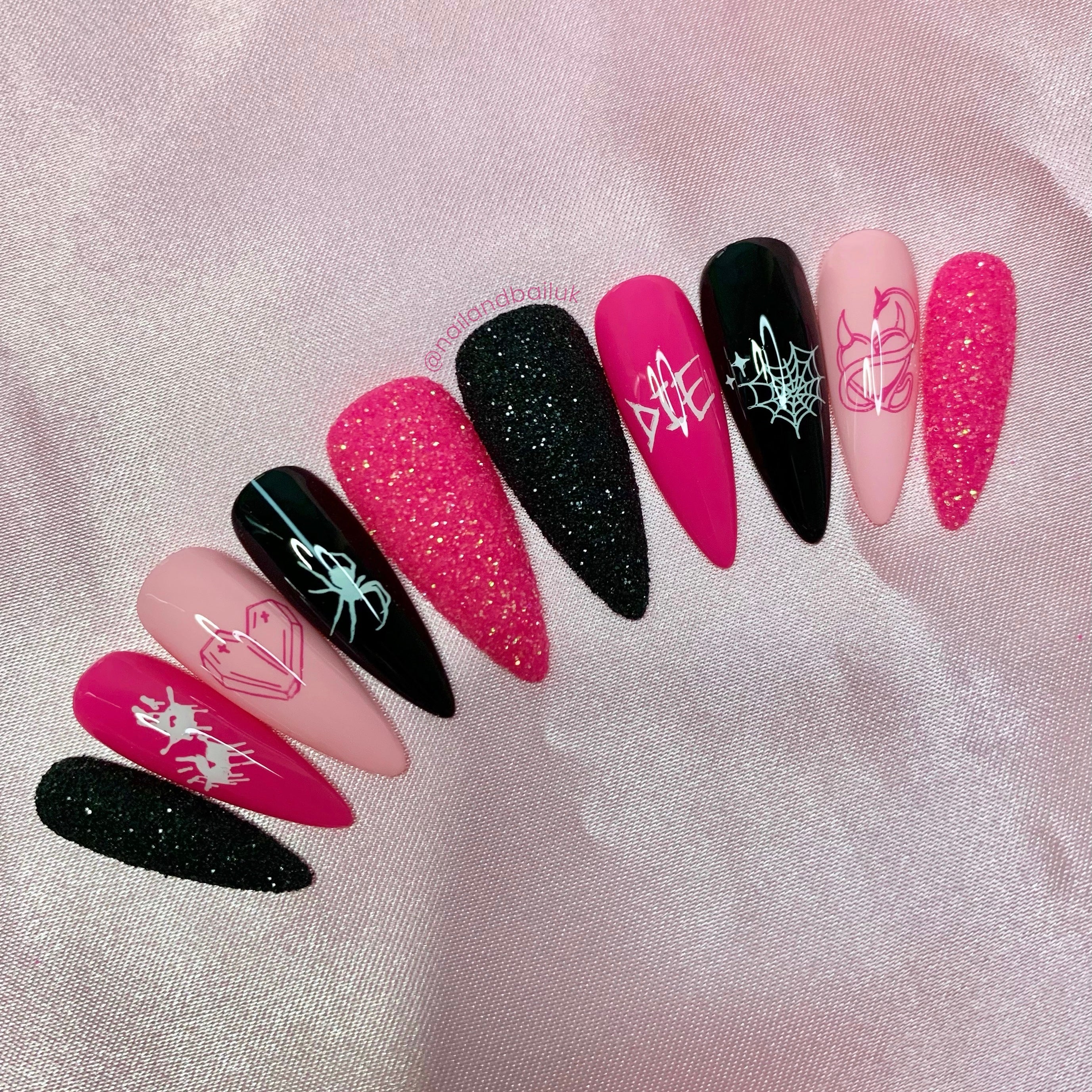 Heart-shaped coffin nail art on spooky Valentine press-on nails