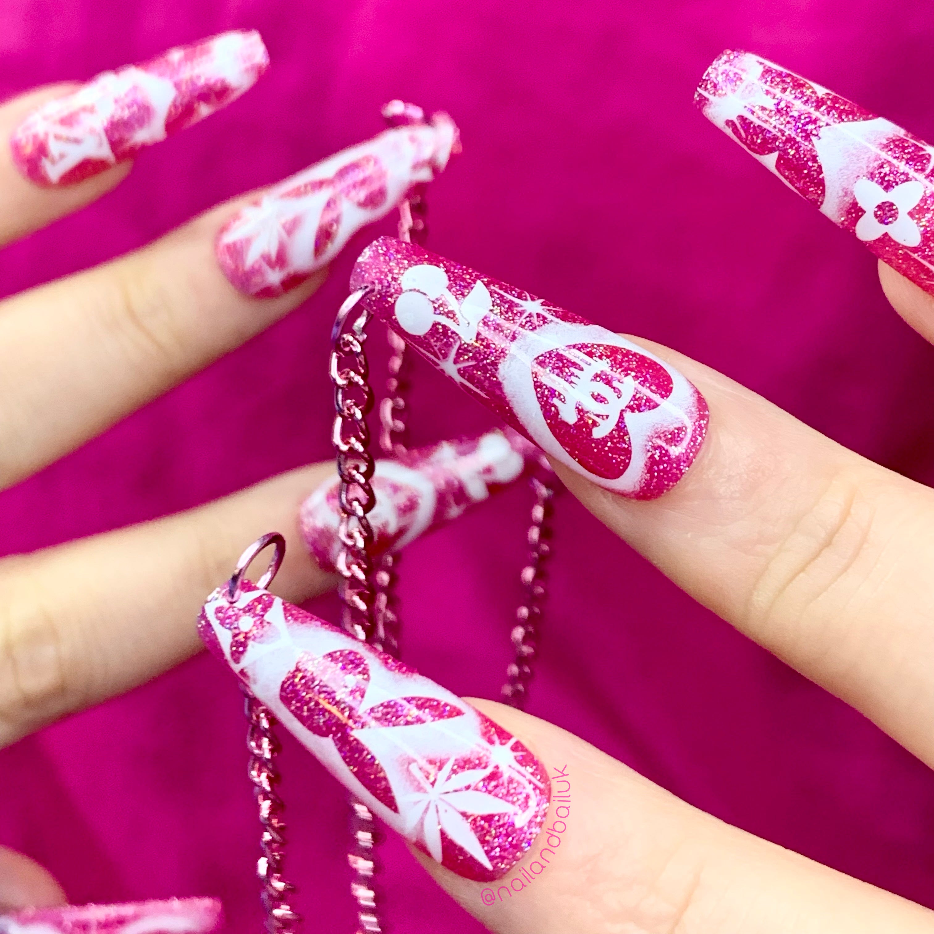 Pink jelly glitter press-on nails with nostalgic airbrushed-inspired 90s nail art